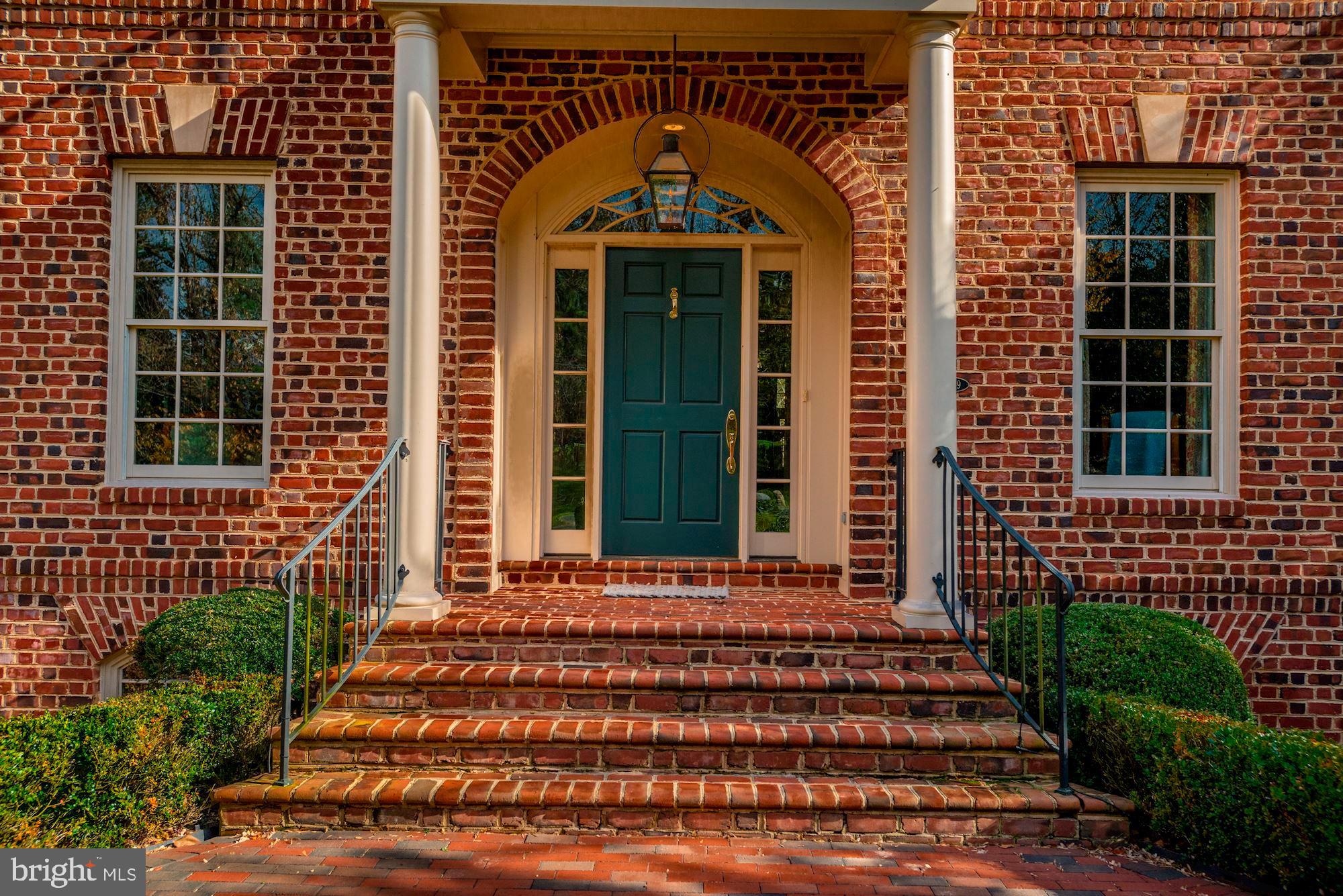 1099 Langley Fork Lane McLean, VA 22101 - Photo 3 of 33 a front view of a house with a yard