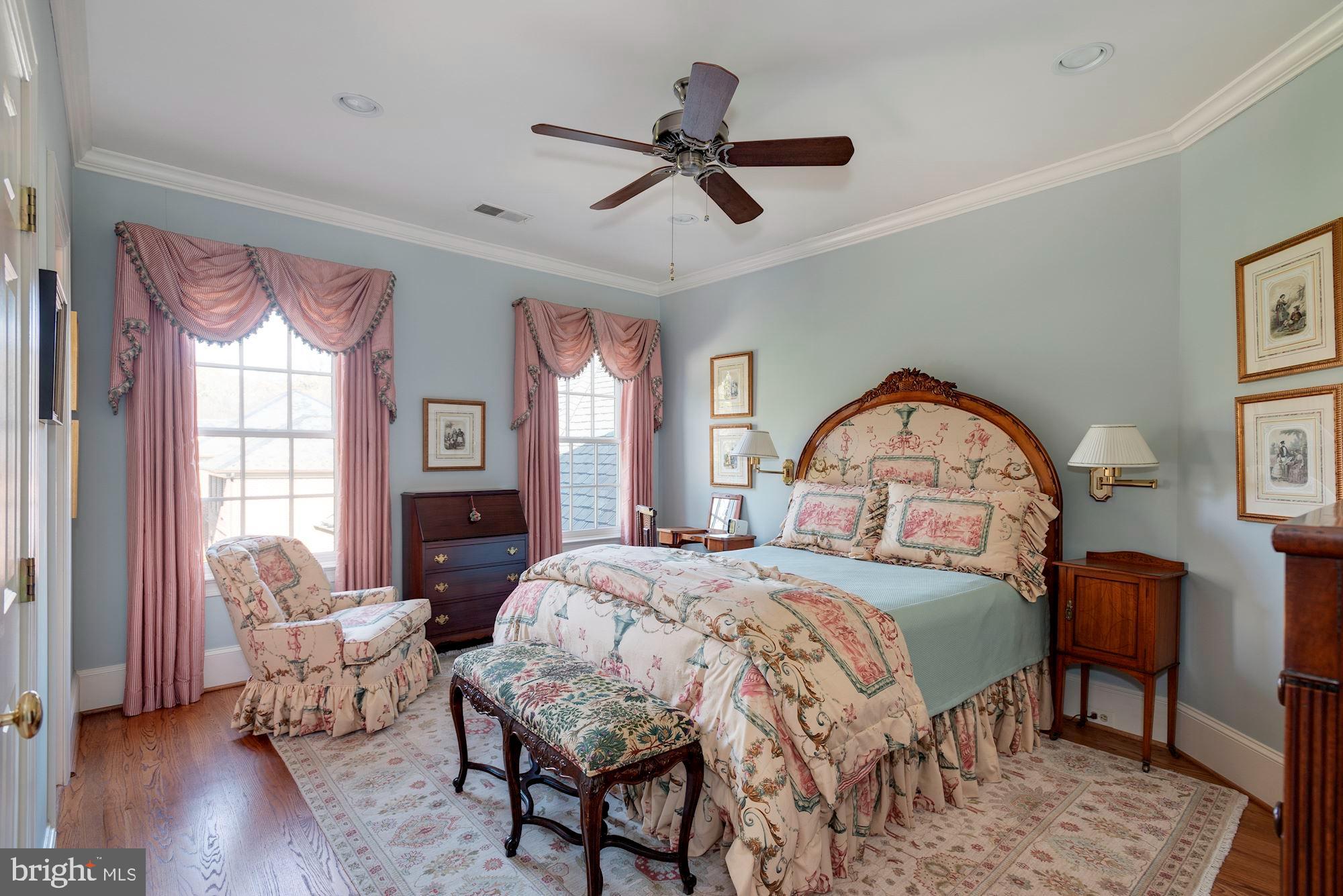 1099 Langley Fork Lane McLean, VA 22101 - Photo 24 of 33 a bedroom with a bed a table and chair