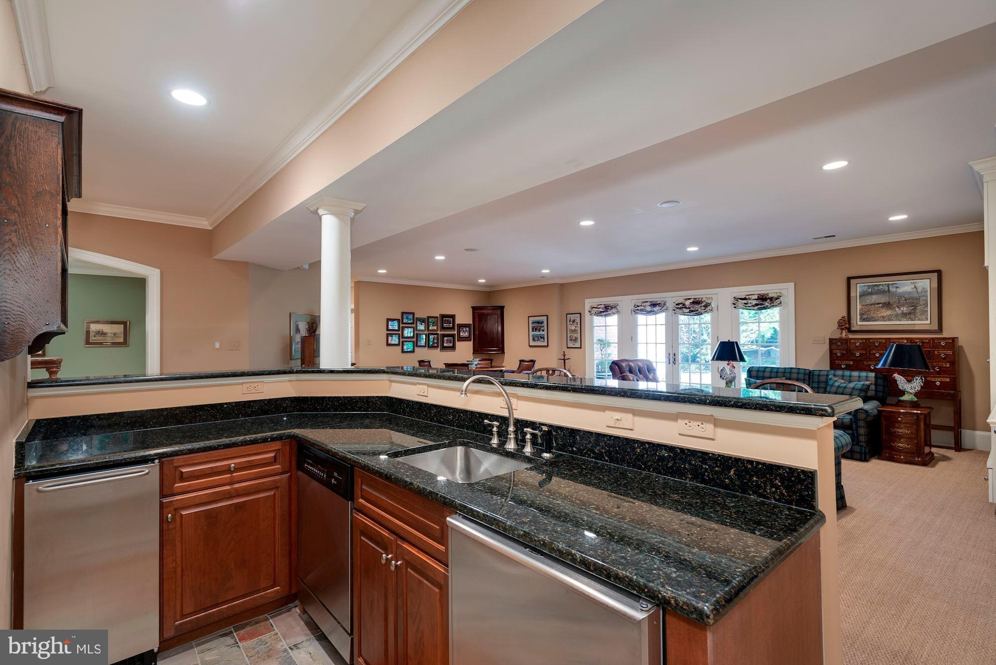 1099 Langley Fork Lane McLean, VA 22101 - Photo 28 of 33 a kitchen with a sink and a stove top oven