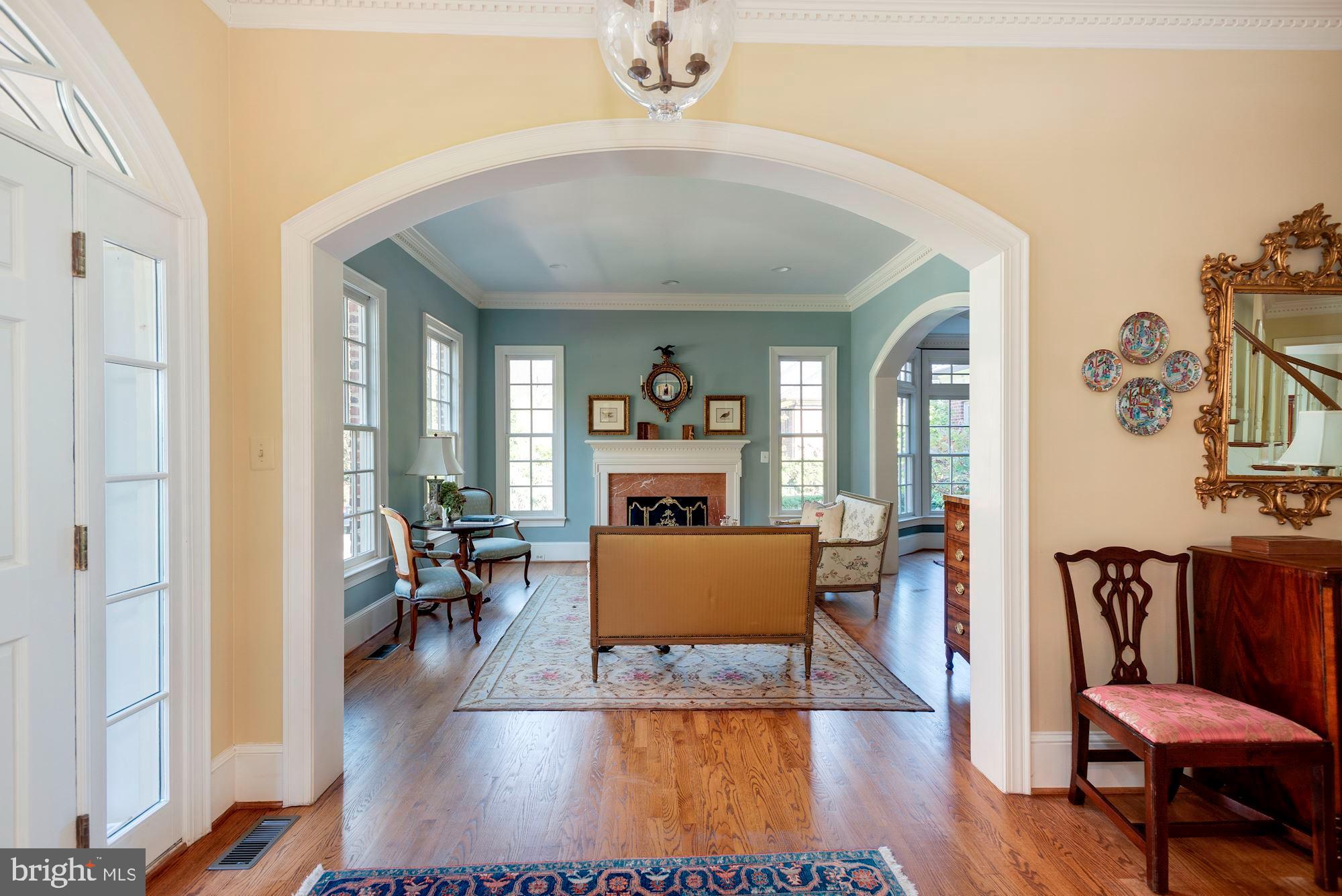 1099 Langley Fork Lane McLean, VA 22101 - Photo 4 of 33 a living room with furniture and a fireplace