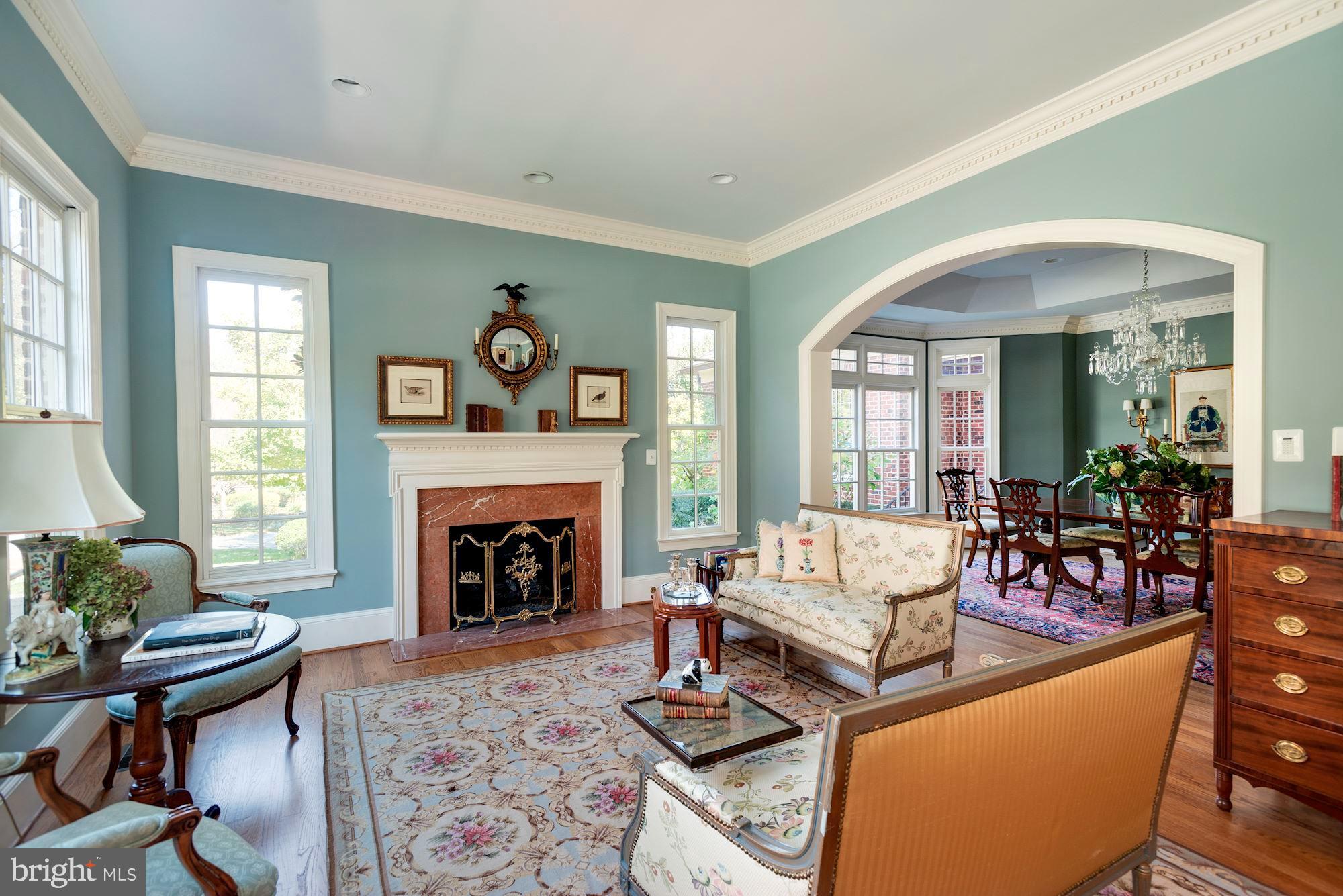 1099 Langley Fork Lane McLean, VA 22101 - Photo 7 of 33 a living room with furniture and a fireplace