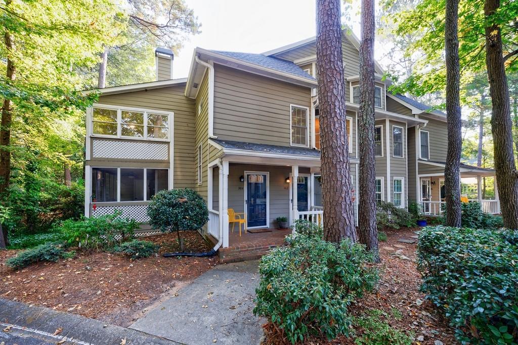 1414 Oakridge Circle Decatur, GA 30033 - Photo 1 of 1 a front view of a house with garden and trees