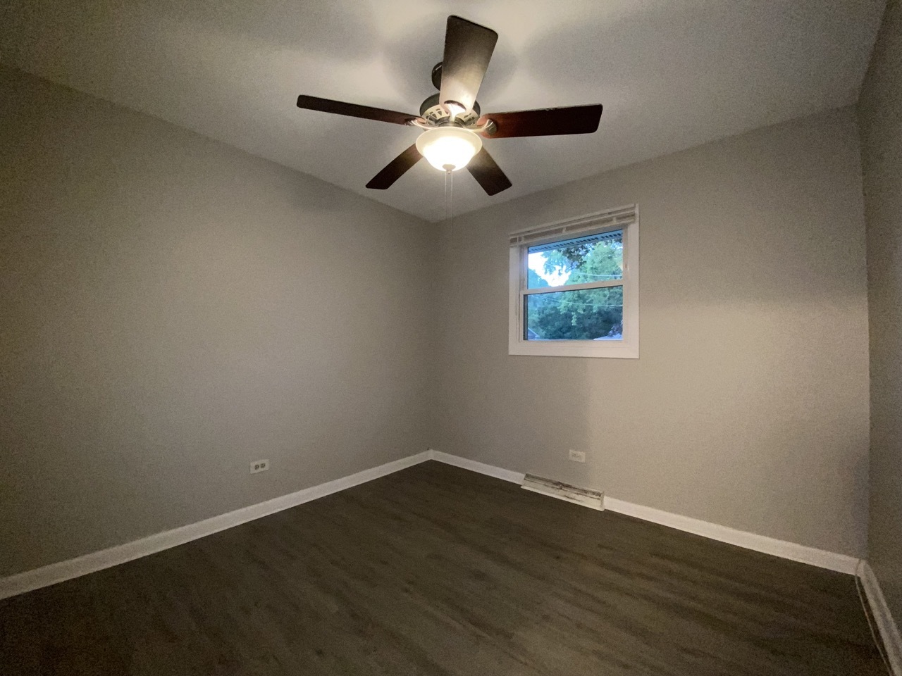 200 Patrick Drive South Elgin, IL 60177 - Photo 11 of 23 a view of an empty room with wooden floor and a ceiling fan