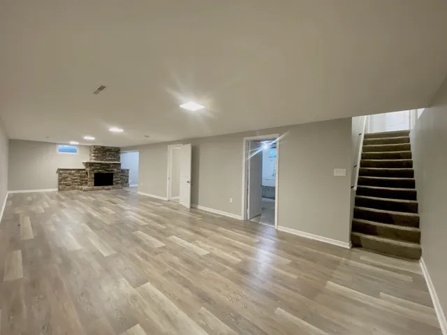 a view of kitchen and hallway with wooden floor