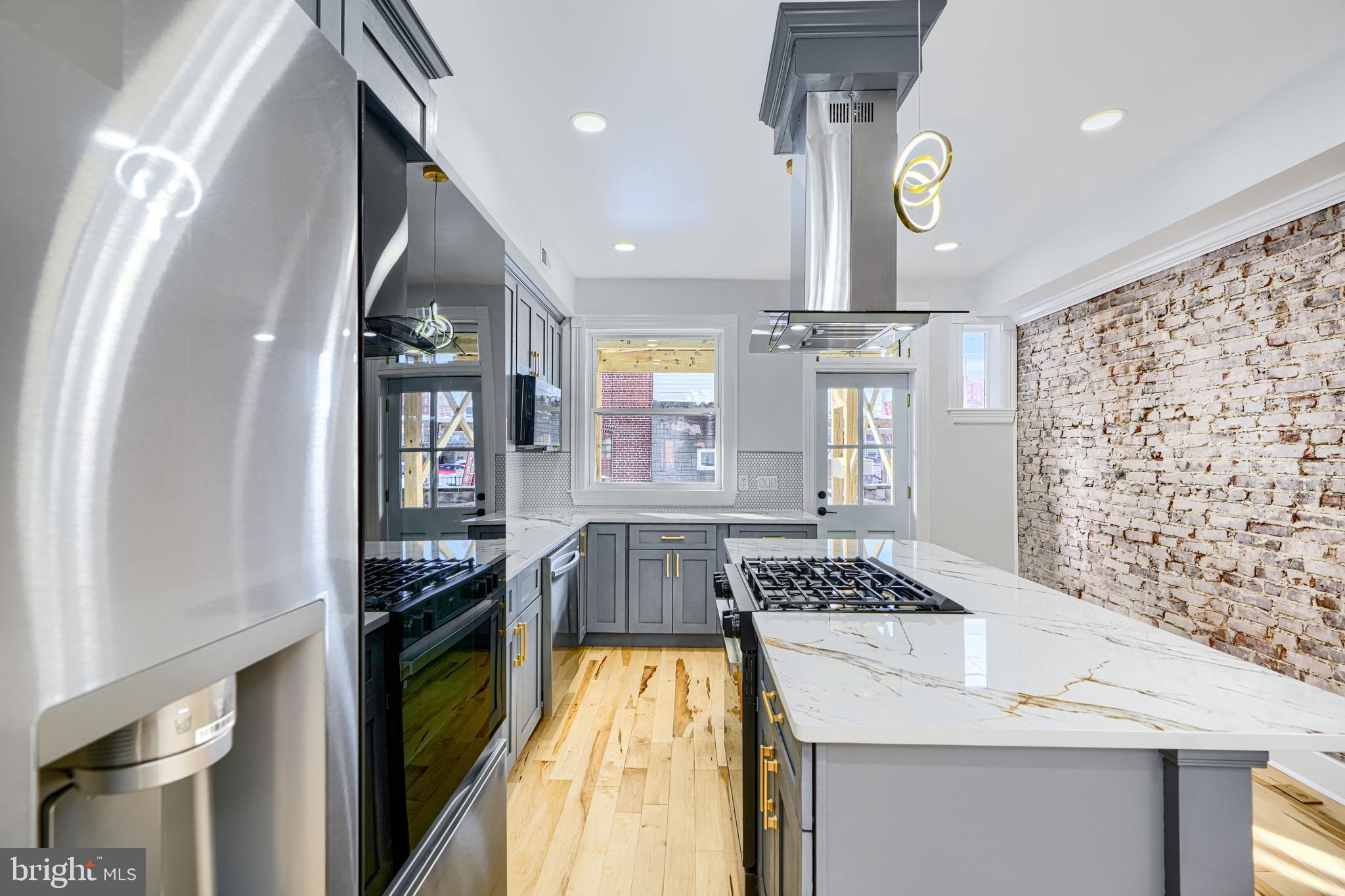 3825 Foster Avenue Baltimore, MD 21224 - Photo 12 of 54 a view of kitchen and dining room with windows