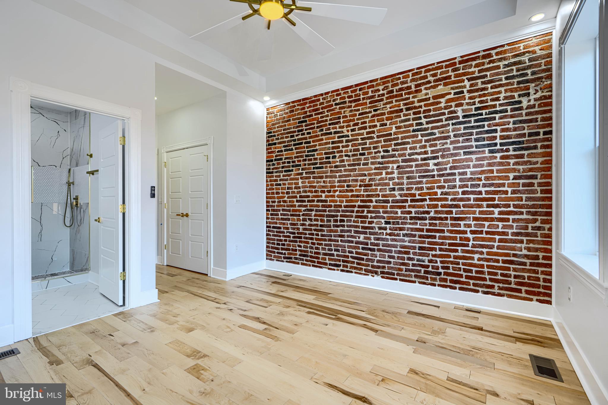 3825 Foster Avenue Baltimore, MD 21224 - Photo 20 of 54 a view of a livingroom with wooden floor and a bathroom