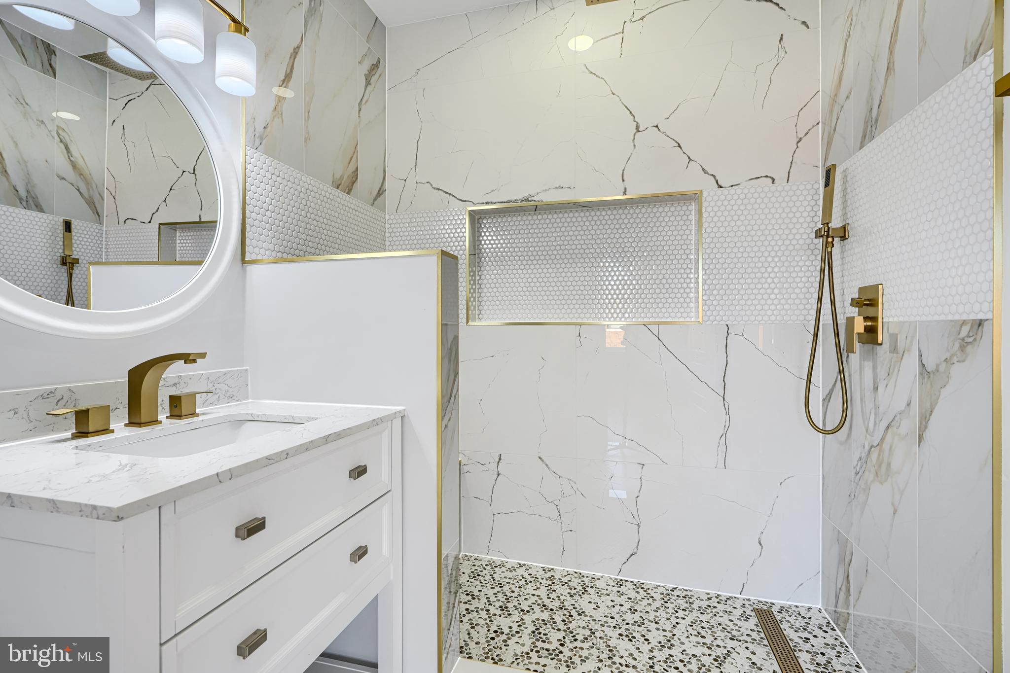 3825 Foster Avenue Baltimore, MD 21224 - Photo 23 of 54 a bathroom with a sink and mirror
