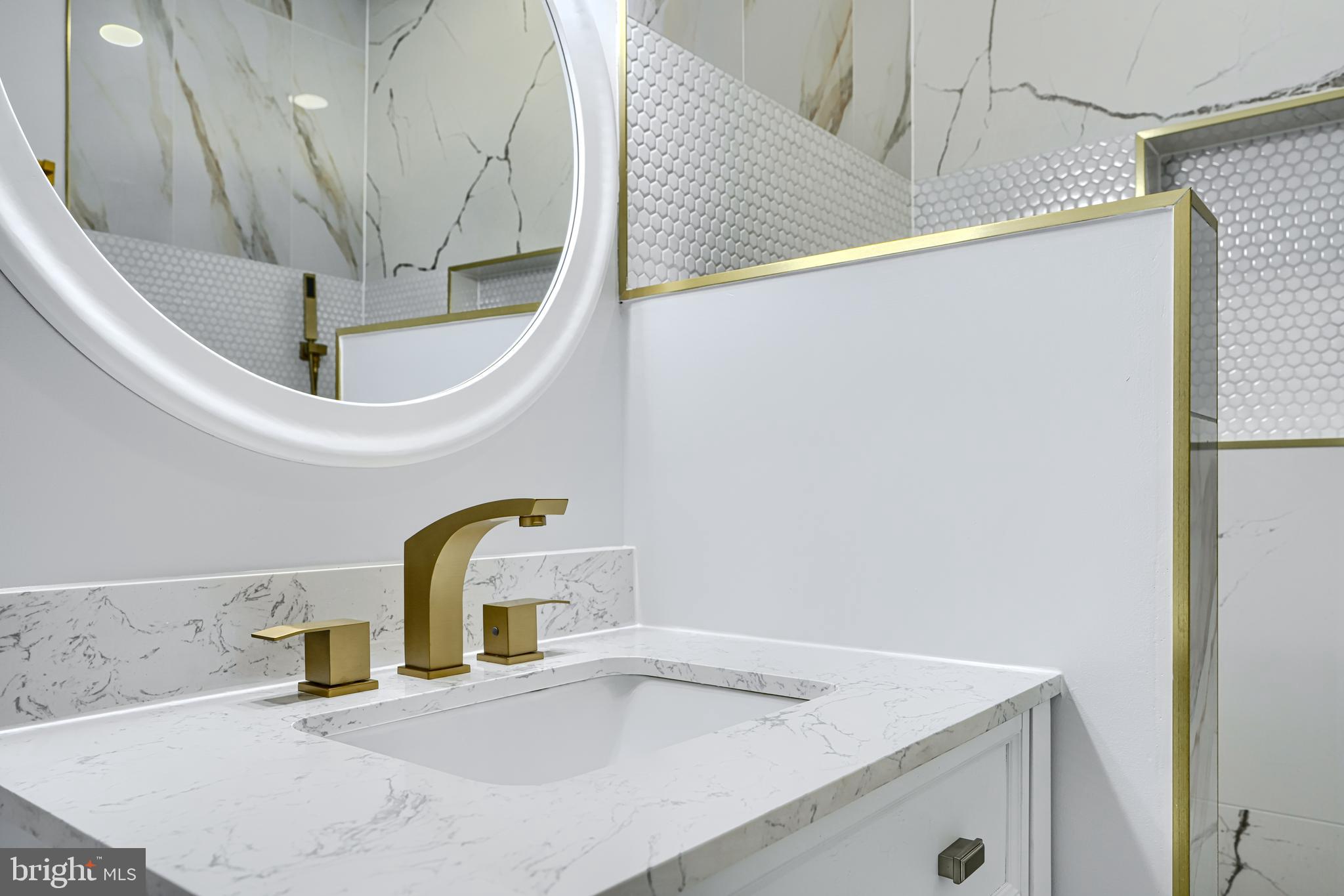 3825 Foster Avenue Baltimore, MD 21224 - Photo 25 of 54 a bathroom with a sink and a mirror