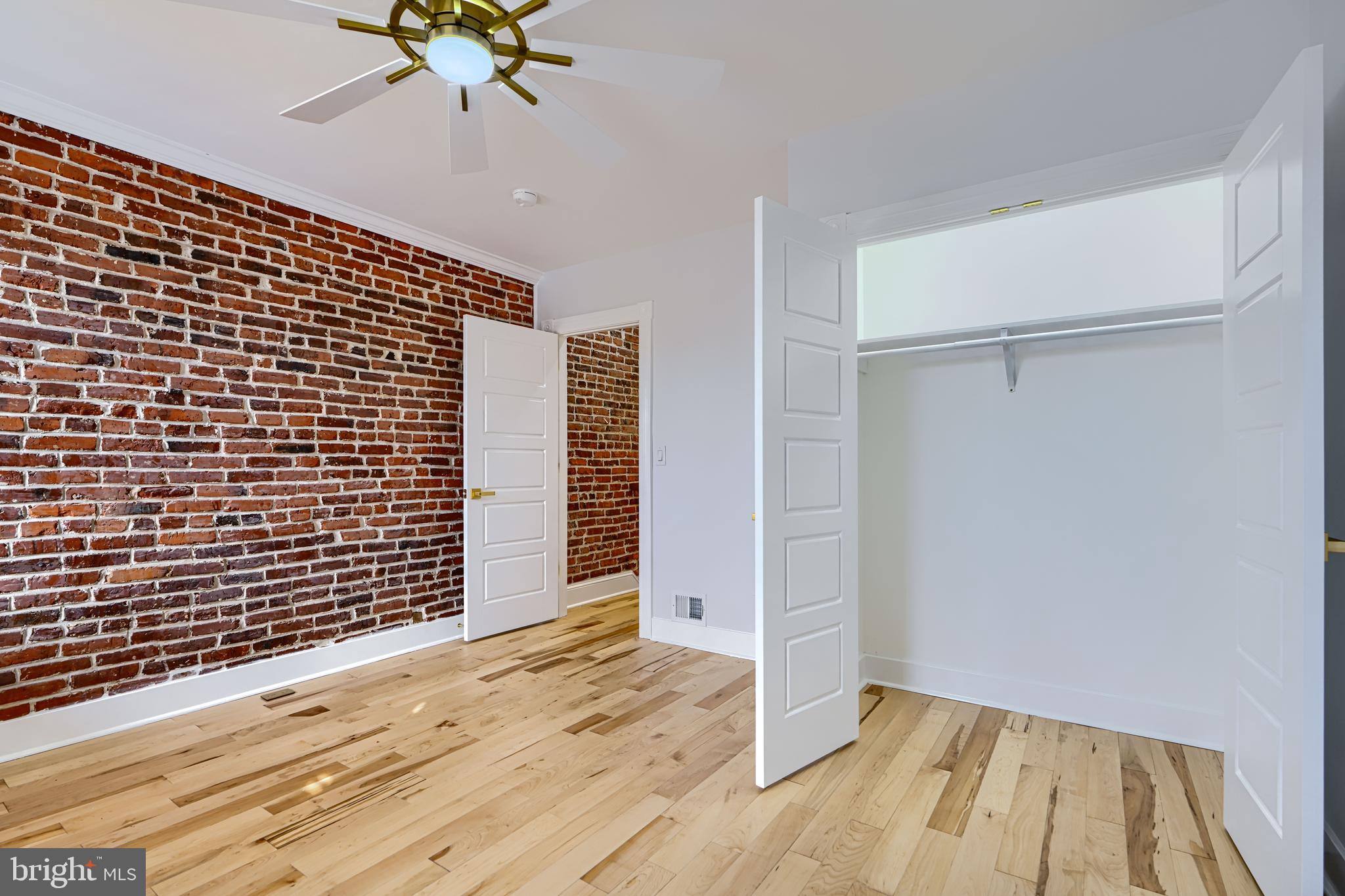 3825 Foster Avenue Baltimore, MD 21224 - Photo 30 of 54 a view of an empty room with wooden floor