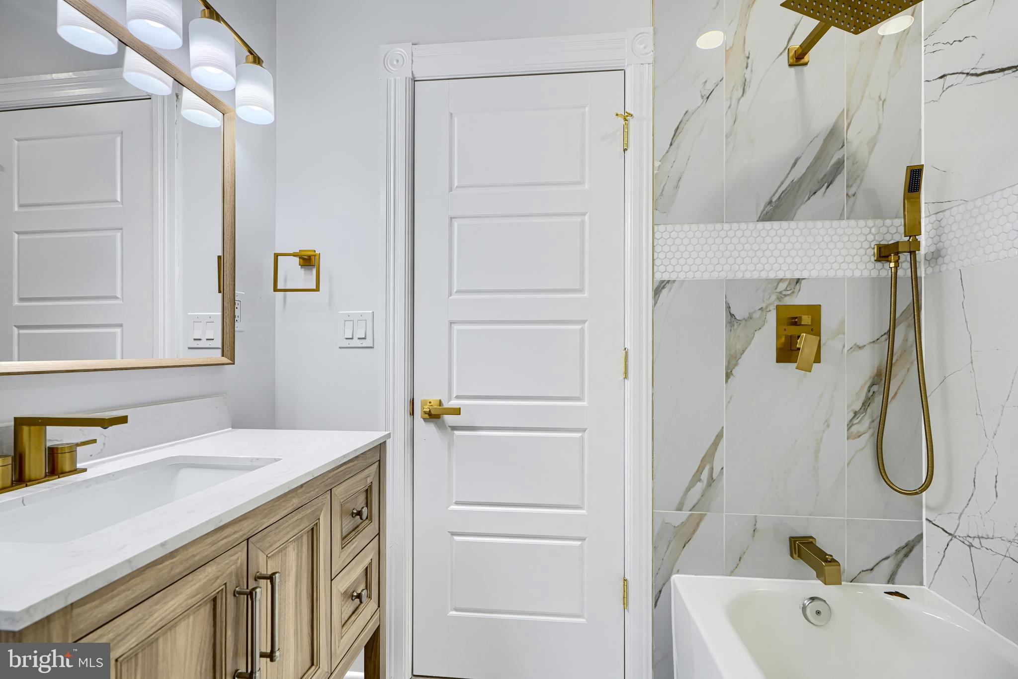 3825 Foster Avenue Baltimore, MD 21224 - Photo 33 of 54 a bathroom with a sink and a mirror