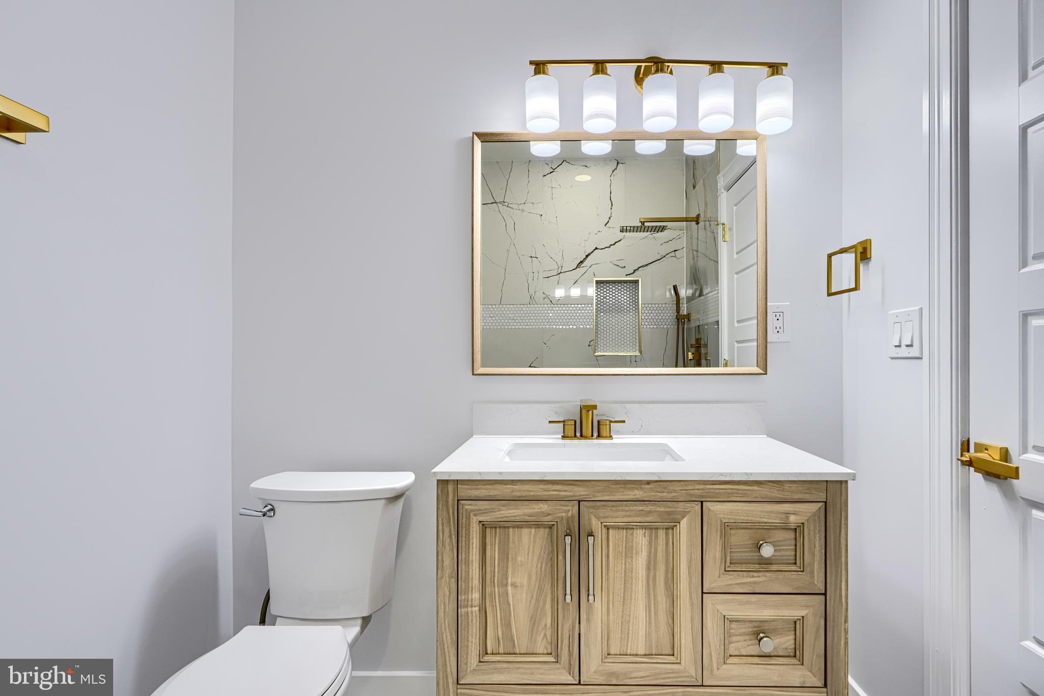 3825 Foster Avenue Baltimore, MD 21224 - Photo 35 of 54 a bathroom with a sink and a mirror