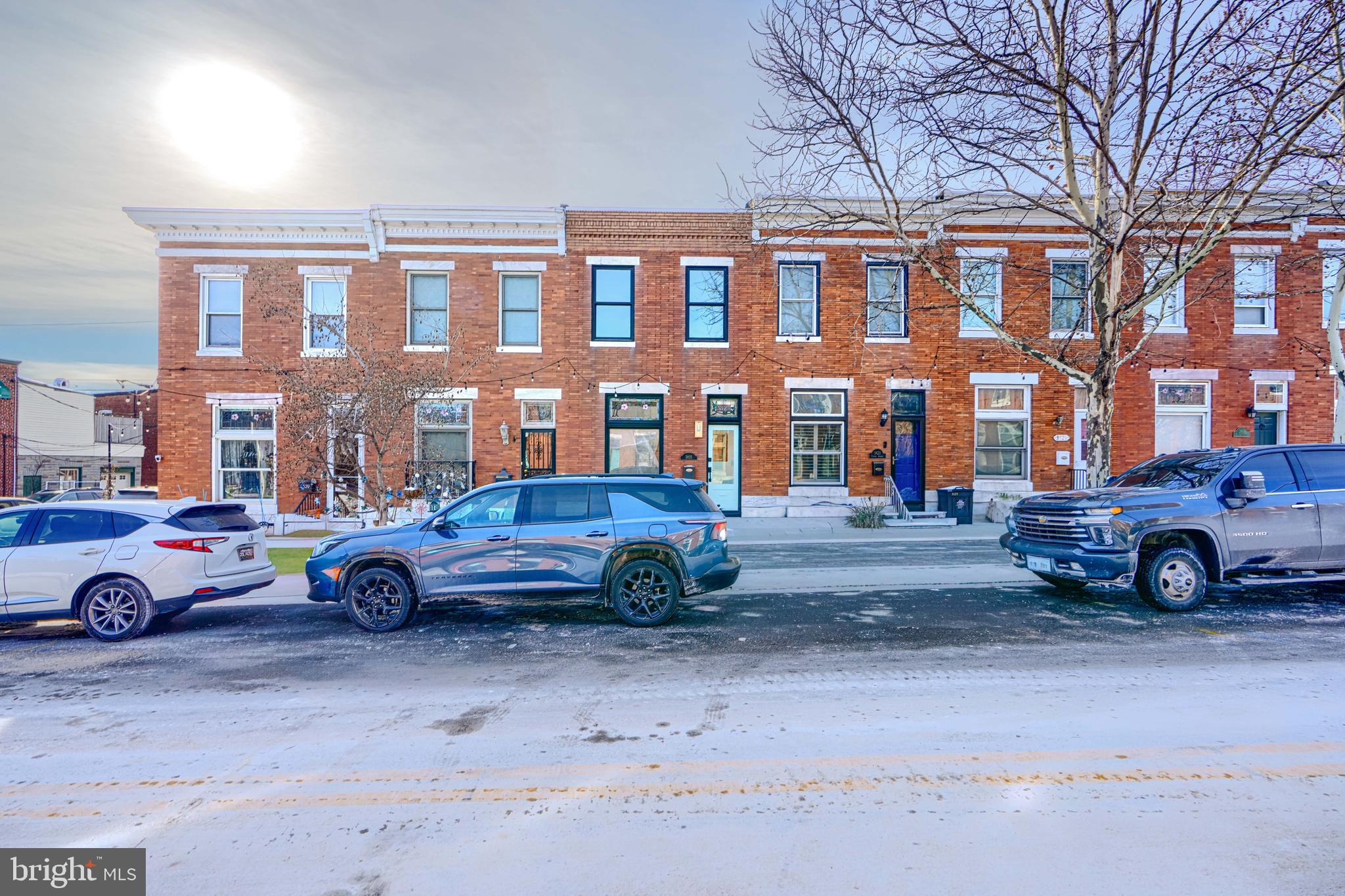3825 Foster Avenue Baltimore, MD 21224 - Photo 53 of 54 a car parked in front of a building