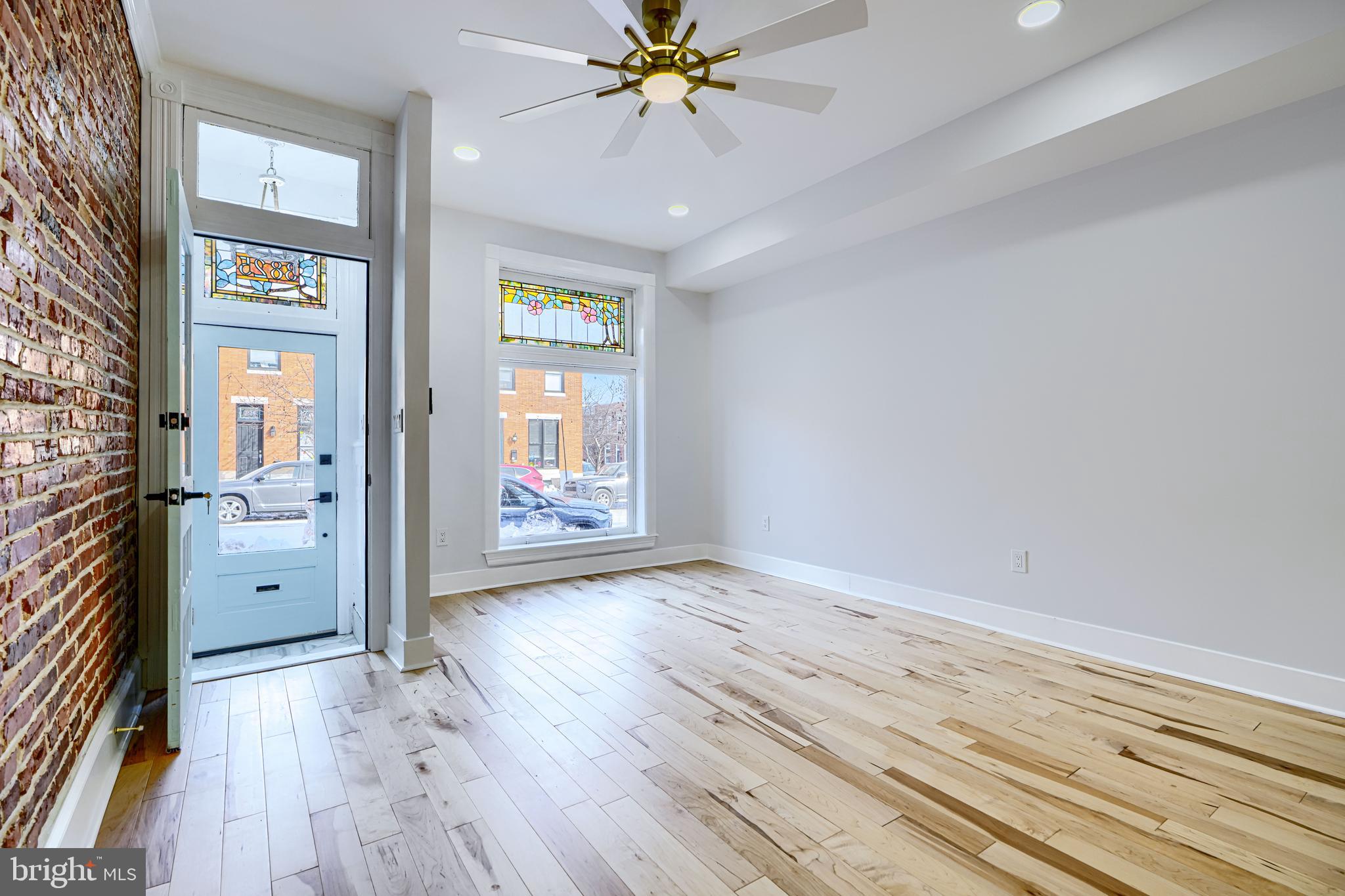 3825 Foster Avenue Baltimore, MD 21224 - Photo 6 of 54 wooden floor in an empty room with a window