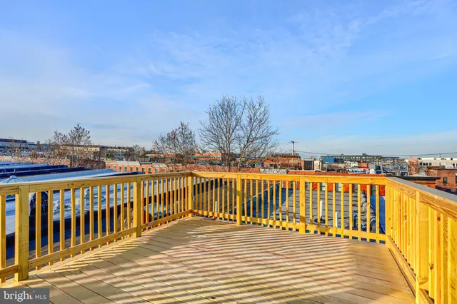 a view of a balcony with wooden floor