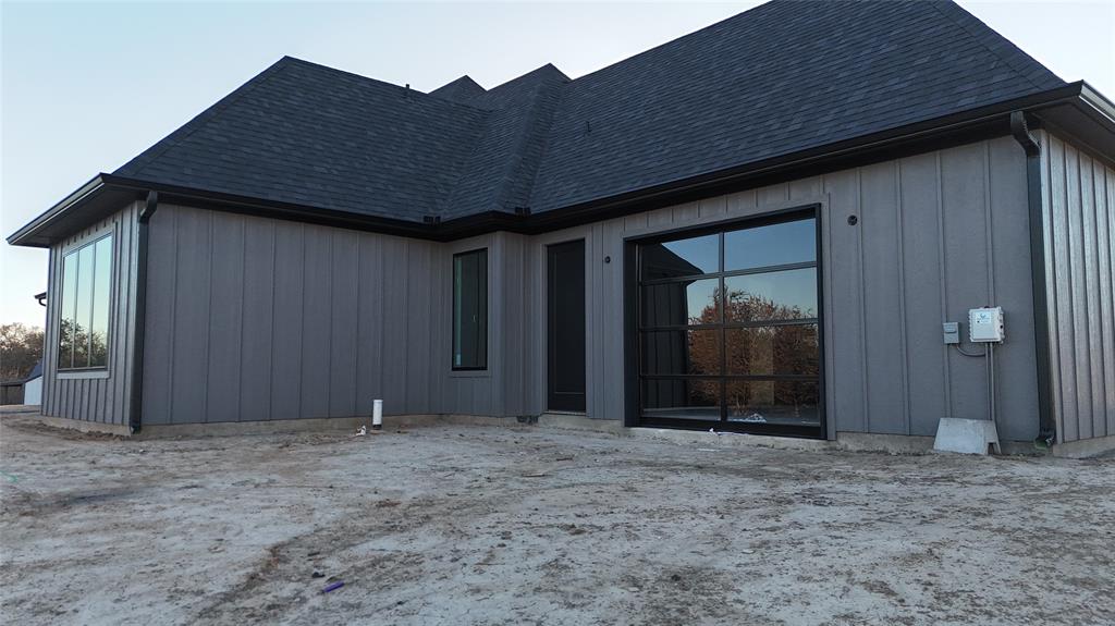 275 Latigo Way Weatherford, TX 76088 - Photo 8 of 11 Steel with glass garage door in flex room