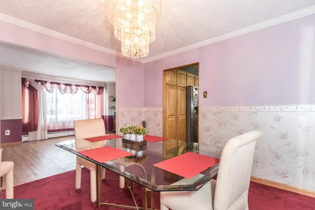 a kitchen with stainless steel appliances granite countertop a sink and a white cabinets