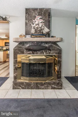 a bedroom with a bed window and a flat screen tv