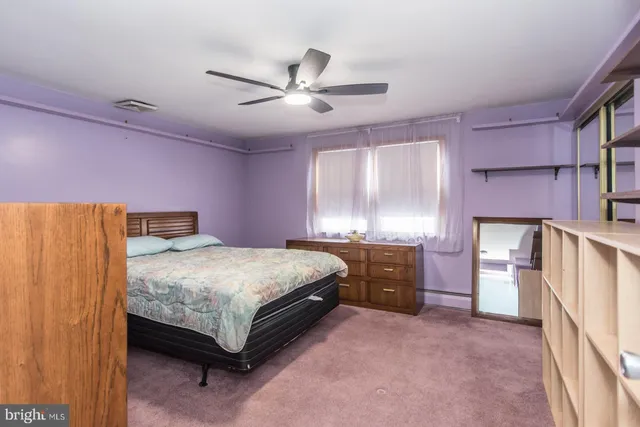 a view of a house with a snow in the yard