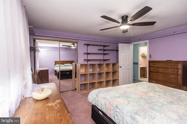 a view of a house with a bench in front of it