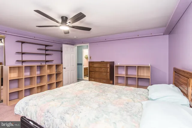 a view of a house with a white fence