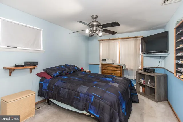 a view of a house with a snow in the yard