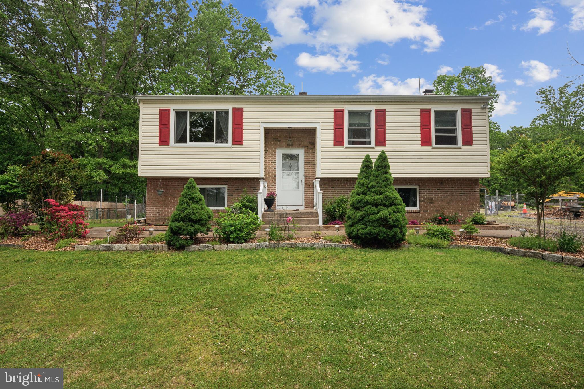 219 Forked Neck Road Shamong, NJ 08088 - Photo 1 of 26 a front view of house with yard and green space