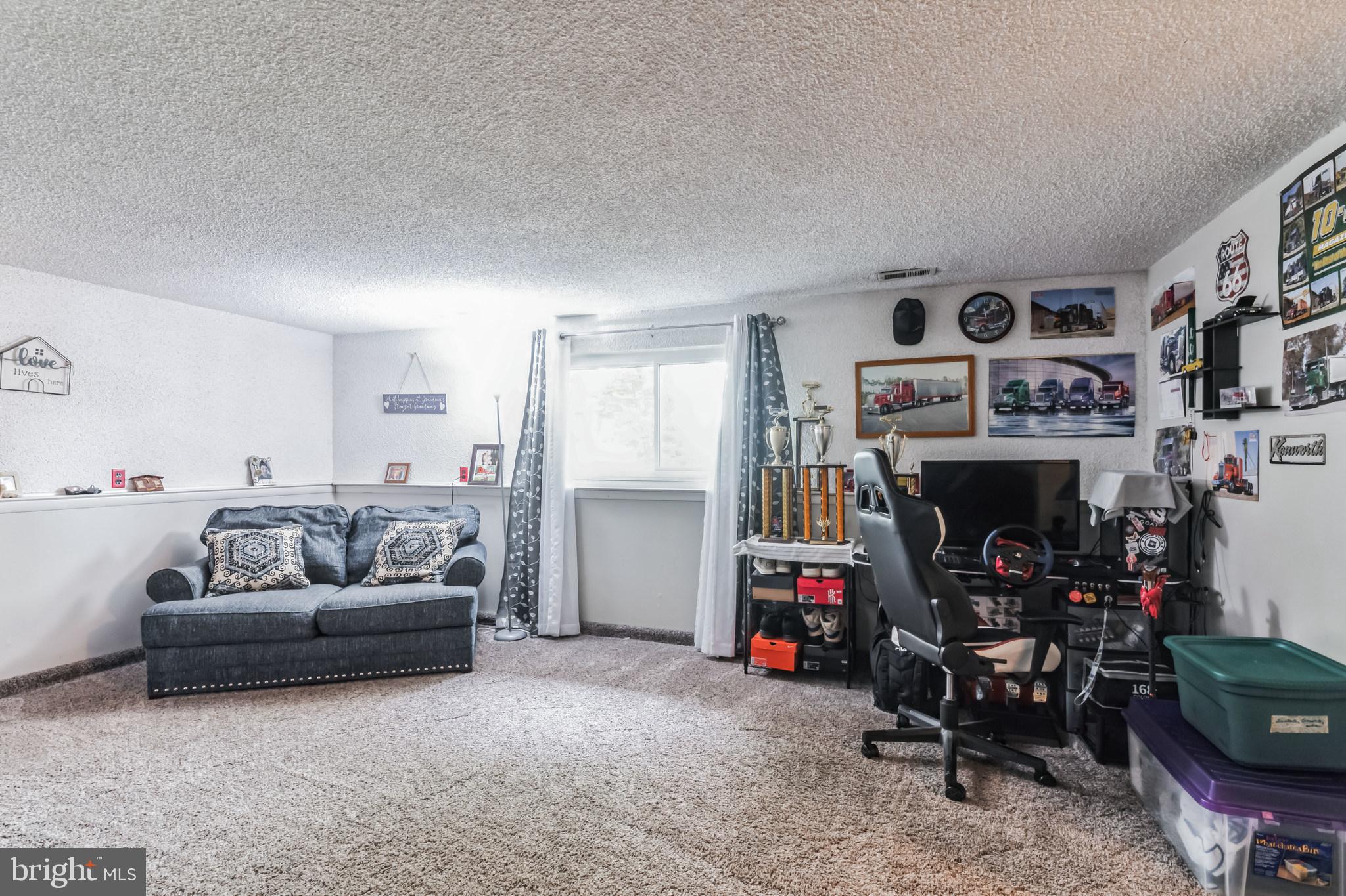 219 Forked Neck Road Shamong, NJ 08088 - Photo 17 of 26 a living room with furniture and a flat screen tv
