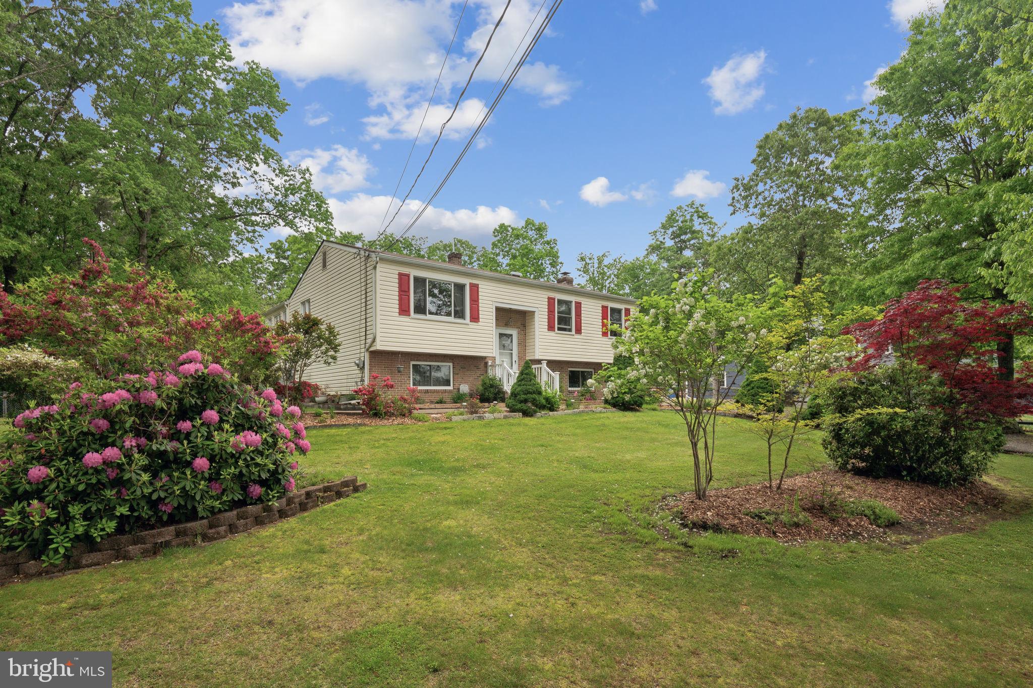 219 Forked Neck Road Shamong, NJ 08088 - Photo 2 of 26 a view of a house with a backyard and garden