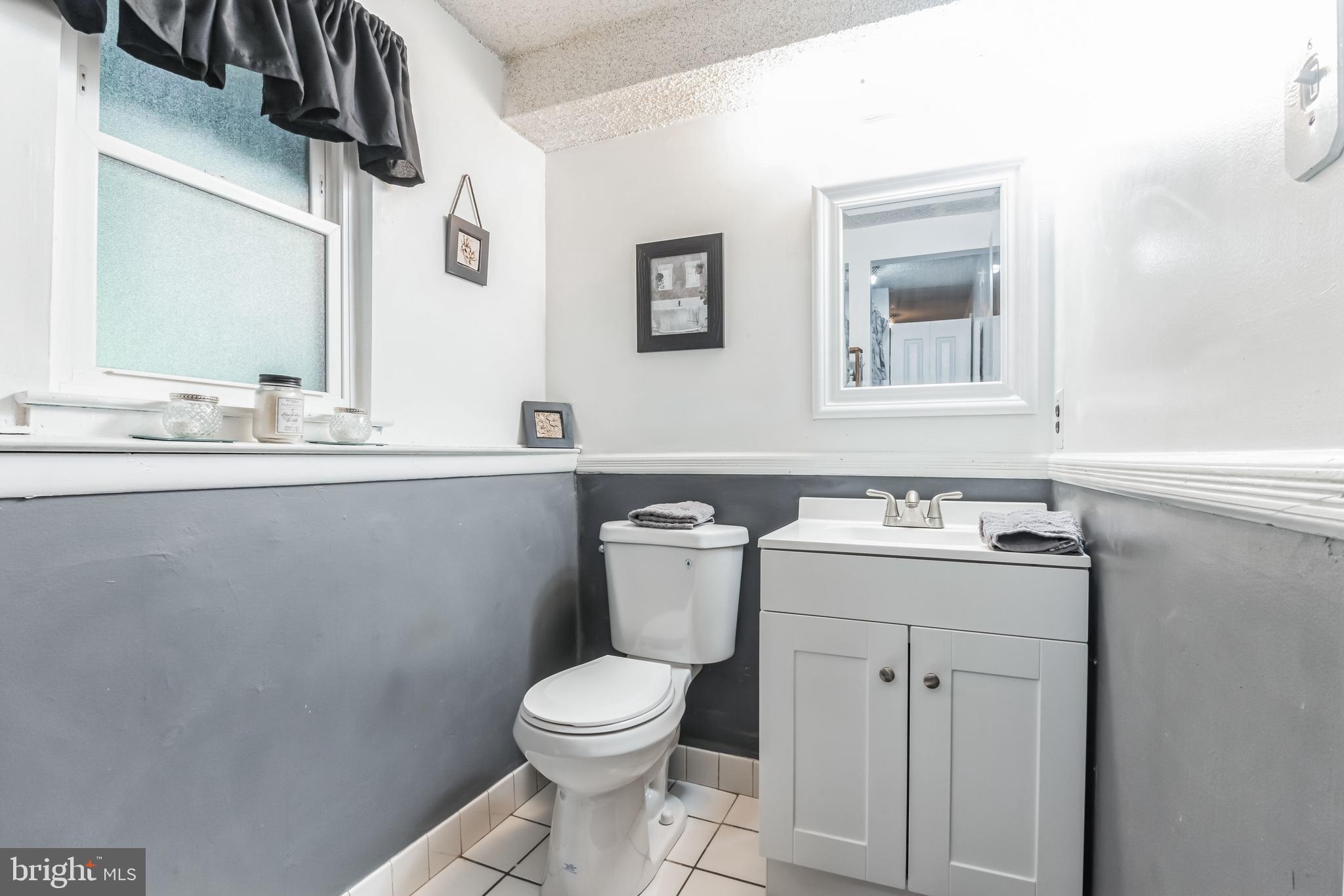 219 Forked Neck Road Shamong, NJ 08088 - Photo 22 of 26 a bathroom with a toilet sink and mirror