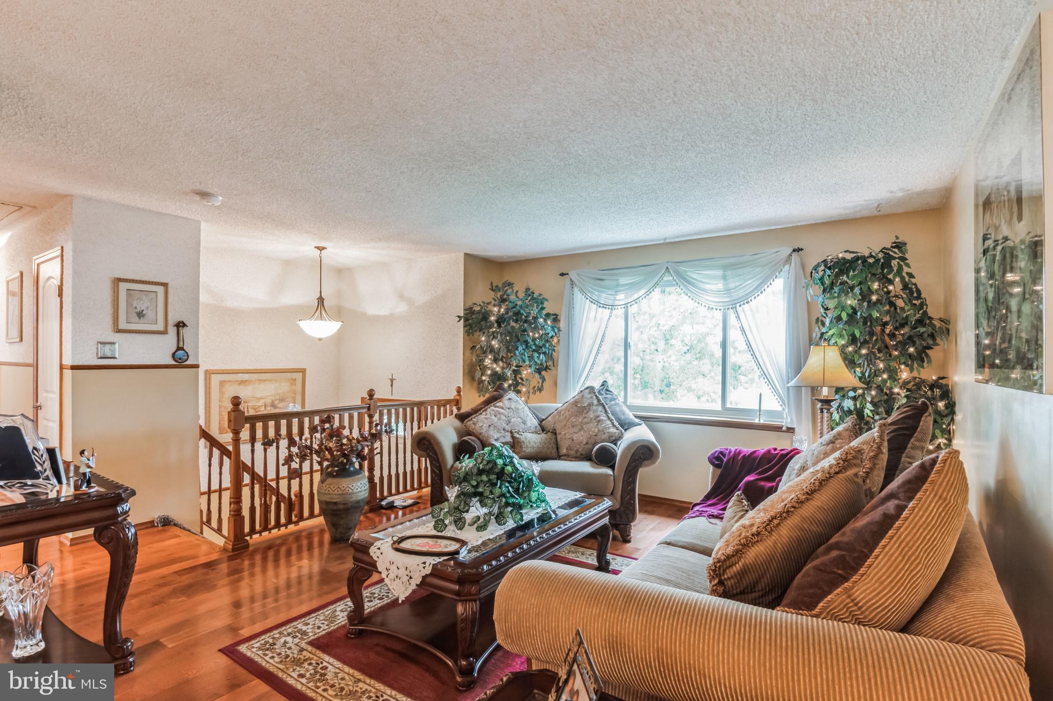 219 Forked Neck Road Shamong, NJ 08088 - Photo 5 of 26 a living room with furniture and a large window