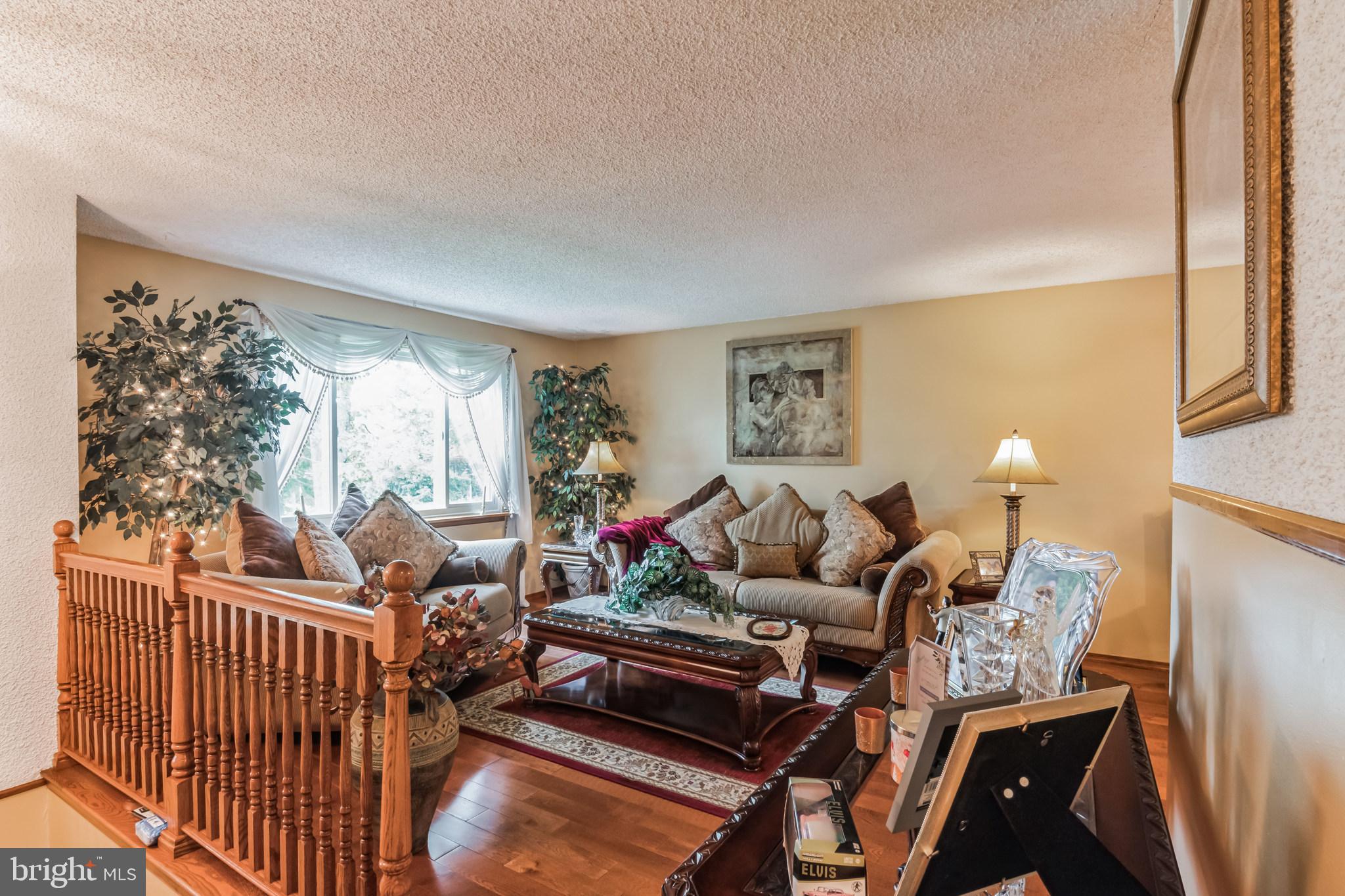 219 Forked Neck Road Shamong, NJ 08088 - Photo 6 of 26 a living room with furniture and a lamp