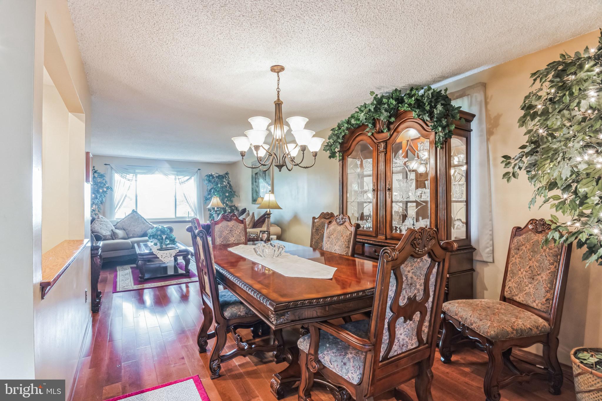 219 Forked Neck Road Shamong, NJ 08088 - Photo 8 of 26 a view of a dining room with furniture window and wooden floor