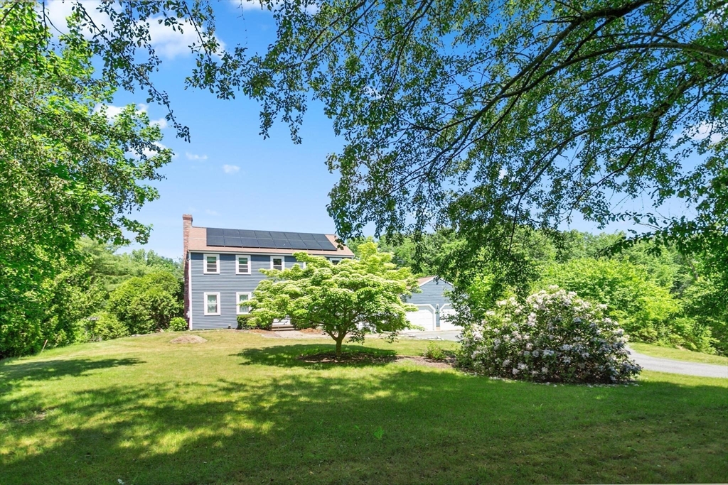 164 Nashua Road Pepperell, MA 01463 - Photo 26 of 28 a view of a house with a garden