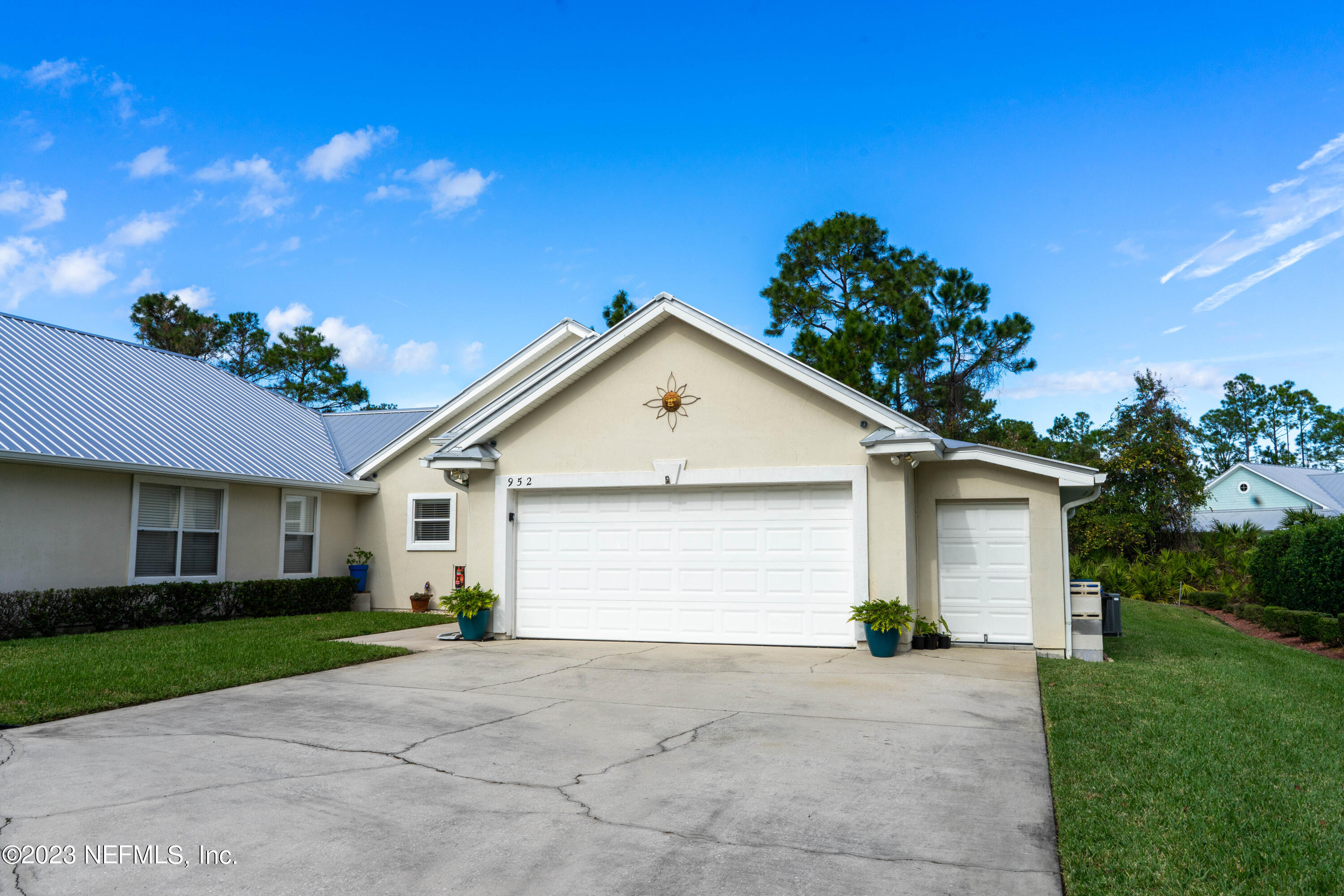 950-952 Irma Way St. Augustine, FL 32086 - Photo 3 of 40 a view of backyard of house and garage