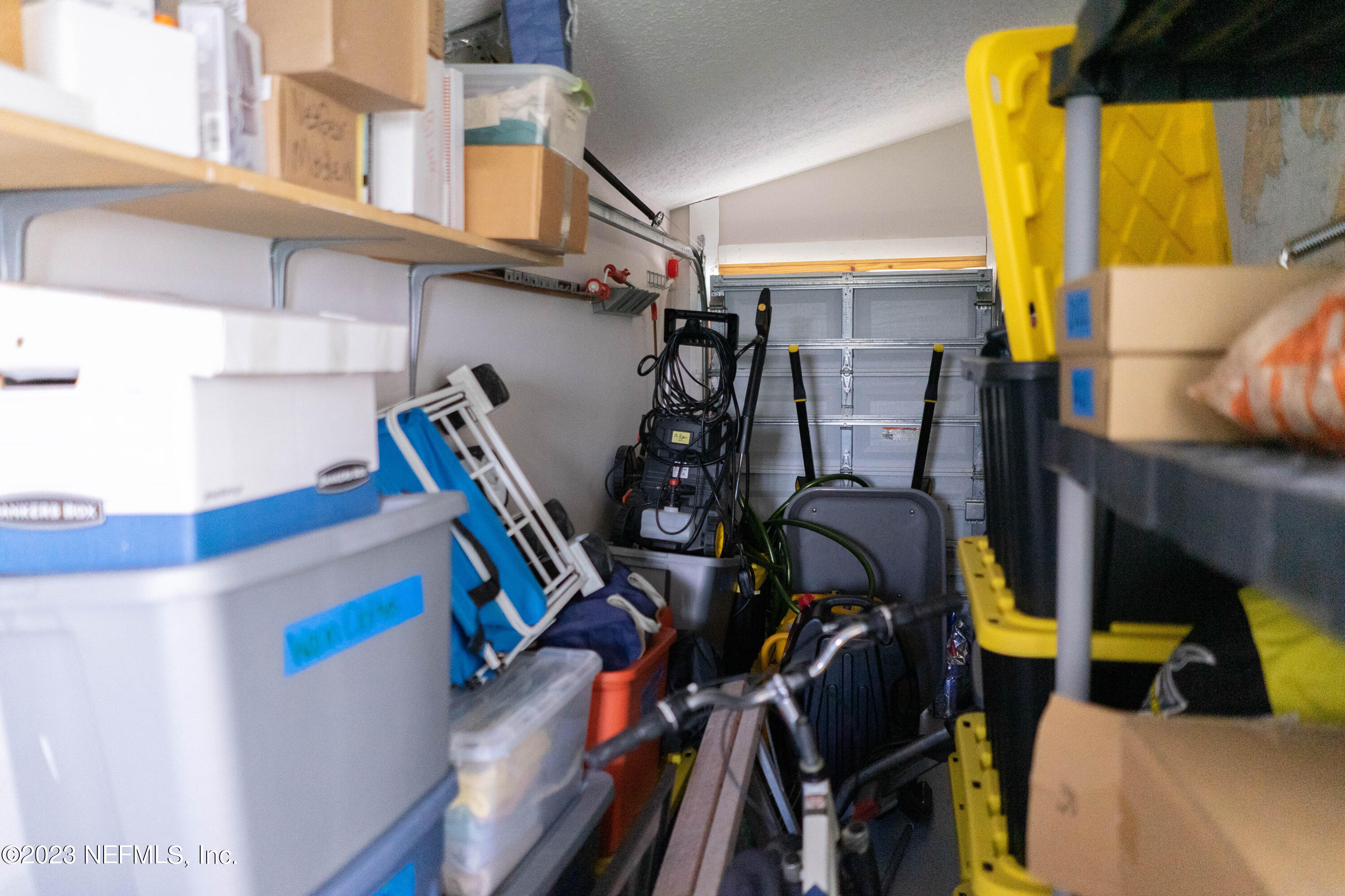 950-952 Irma Way St. Augustine, FL 32086 - Photo 35 of 40 a view of walk in closet with clothes and shoes