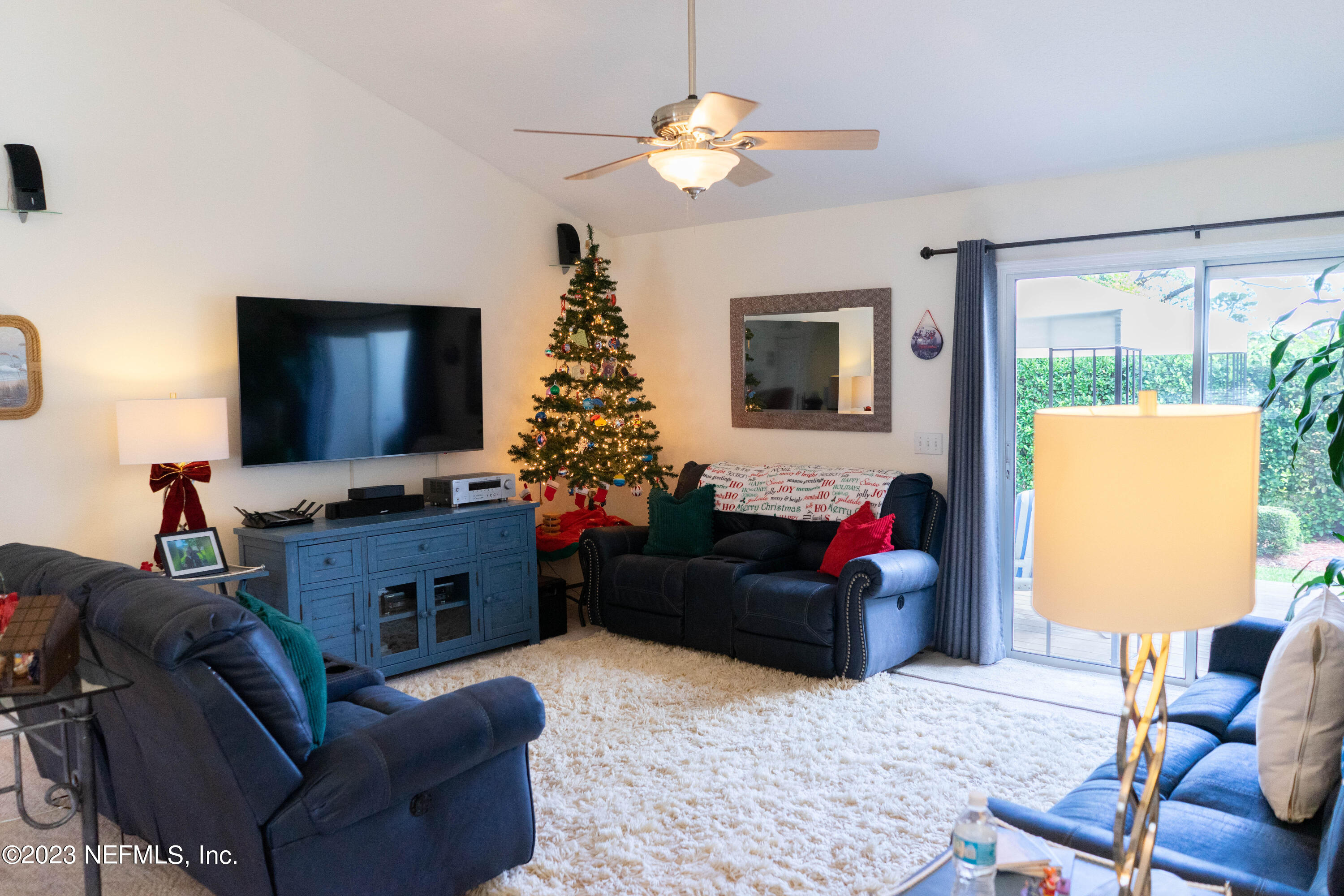 950-952 Irma Way St. Augustine, FL 32086 - Photo 7 of 40 a living room with furniture and a flat screen tv