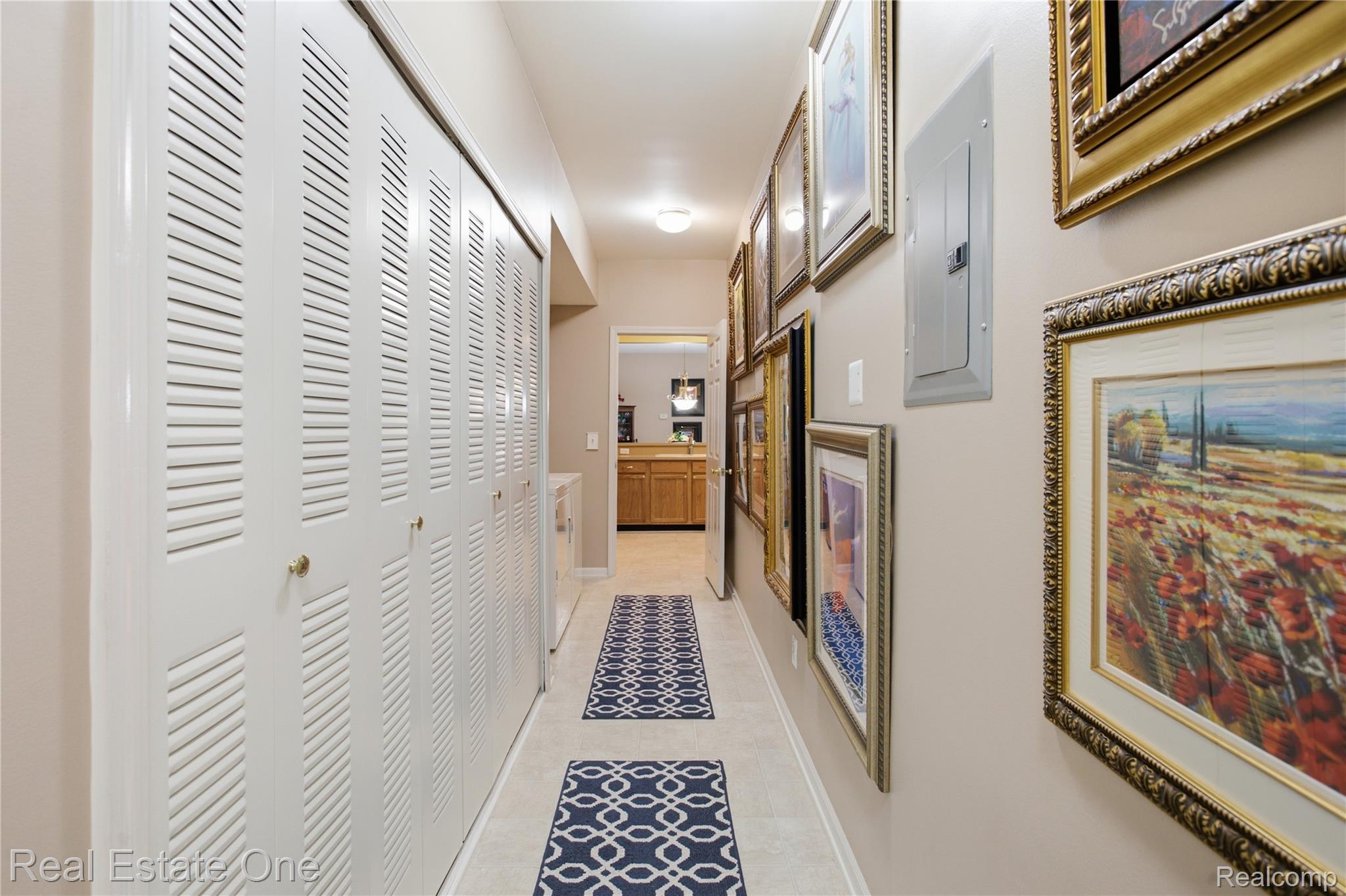 1828 Flagstone Circle, Unit 40 Rochester, MI 48307 - Photo 6 of 22 Hallway featuring louvered bi-fold closet doors, recessed lighting, and tile flooring