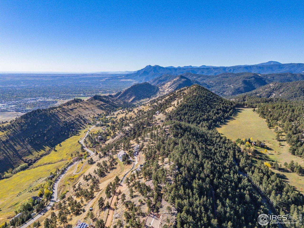 6109 Red Hill Road Boulder, CO 80302 - Photo 1 of 22 a view of a city with mountains in the background
