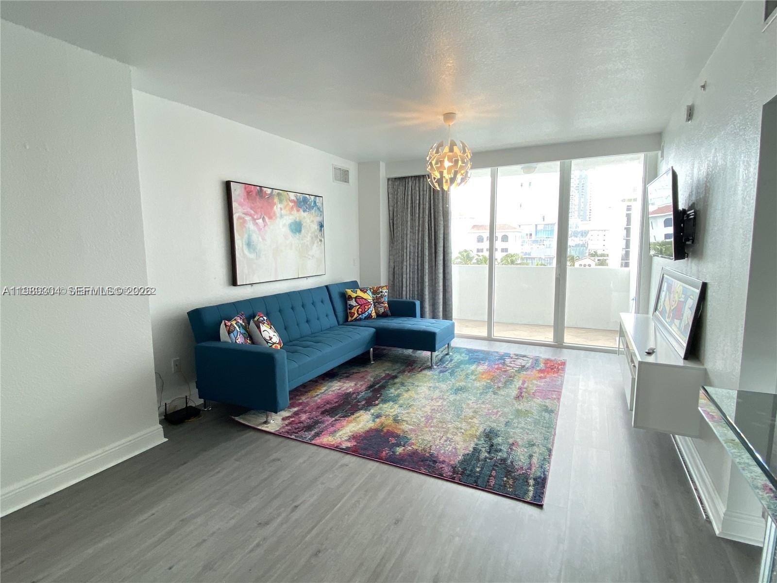 500 Northeast 29th Street, Unit 608 Miami, FL 33137 - Photo 11 of 36 a living room with furniture rug and a large window