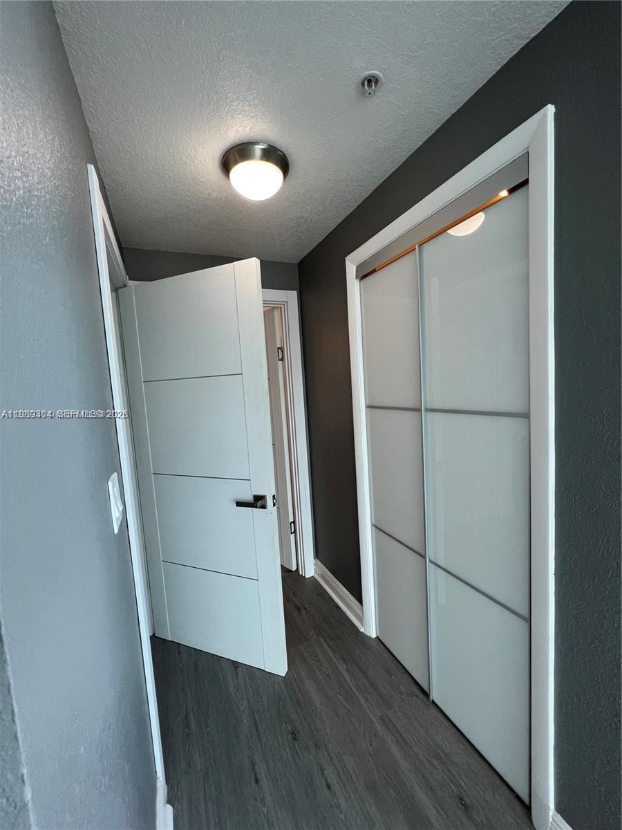 500 Northeast 29th Street, Unit 608 Miami, FL 33137 - Photo 19 of 36 an empty room with wooden floor