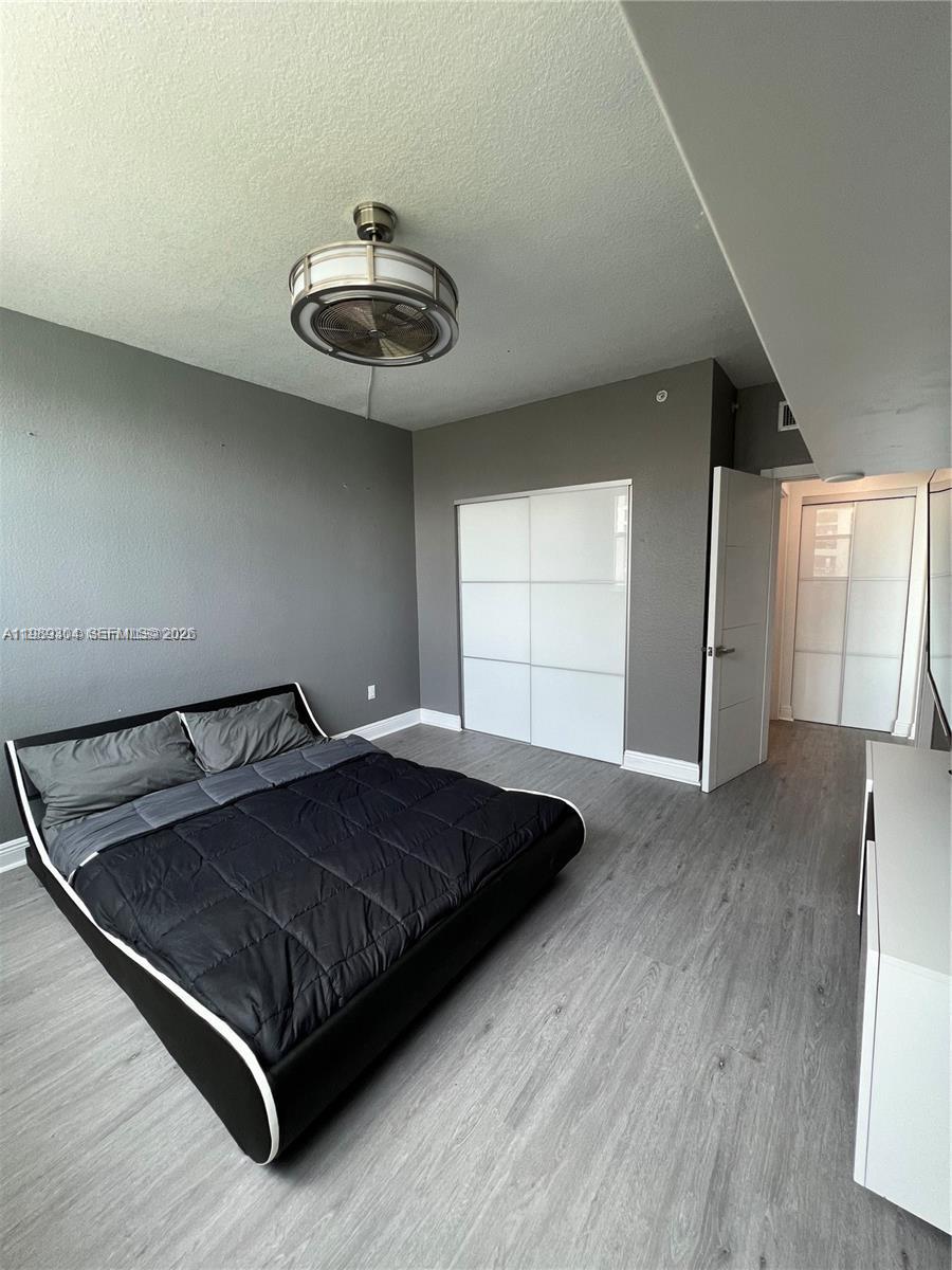 500 Northeast 29th Street, Unit 608 Miami, FL 33137 - Photo 26 of 36 a bed sitting in a room next to a window