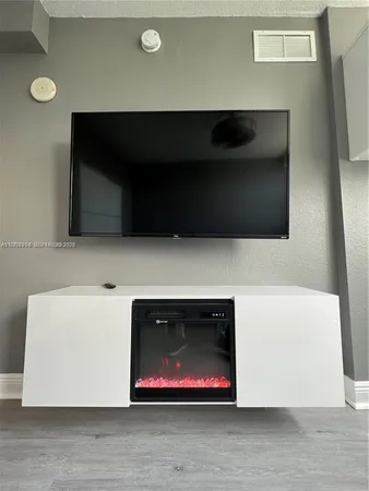 a living room with a flat screen tv