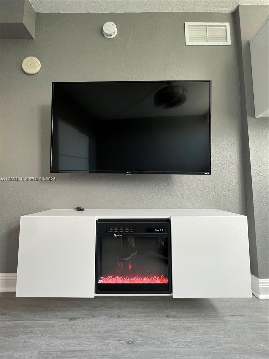 500 Northeast 29th Street, Unit 608 Miami, FL 33137 - Photo 27 of 36 a living room with a flat screen tv