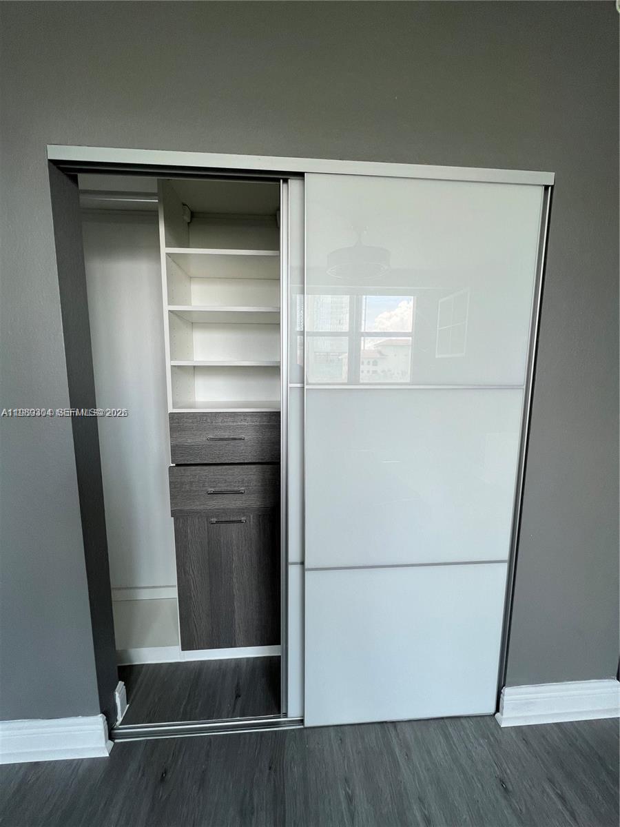 500 Northeast 29th Street, Unit 608 Miami, FL 33137 - Photo 28 of 36 a view of walk in closet with empty racks