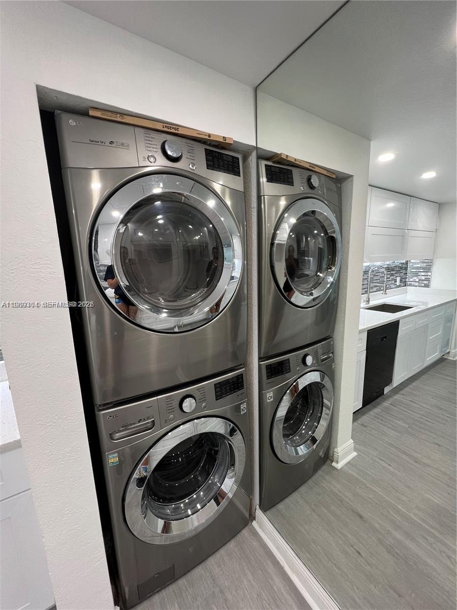 500 Northeast 29th Street, Unit 608 Miami, FL 33137 - Photo 10 of 36 a utility room with sink dryer and washer