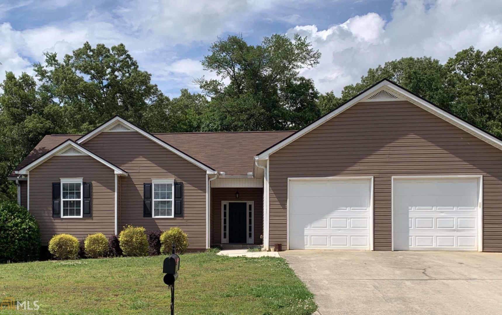 23 Seay Drive Southeast, Unit 21 Rome, GA 30161 - Photo 1 of 1 a front view of a house with garden