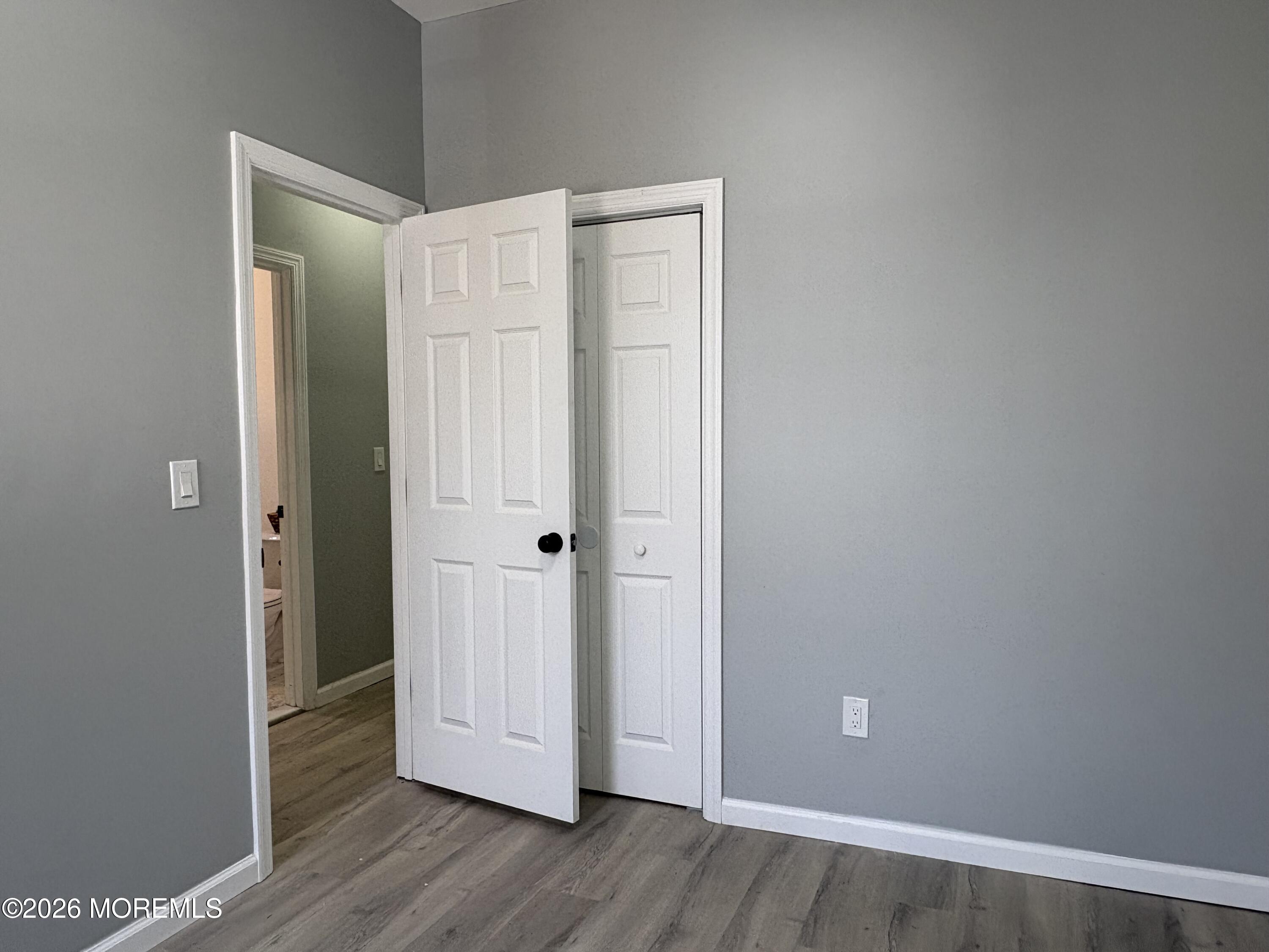 456 Harrison Street, Unit 2 Passaic, NJ 07055 - Photo 11 of 15 a view of an empty room with wooden floor and closet