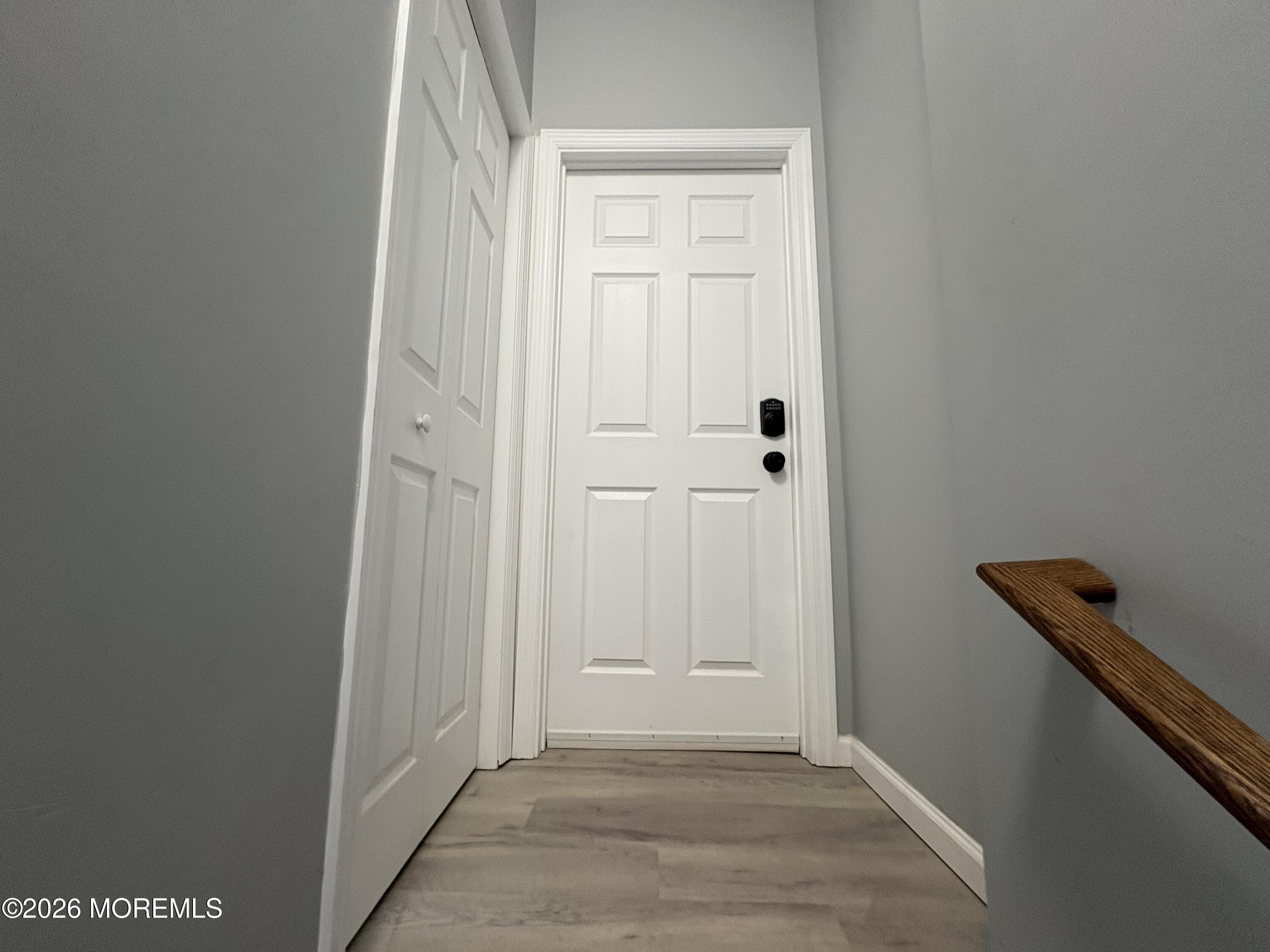 456 Harrison Street, Unit 2 Passaic, NJ 07055 - Photo 3 of 15 a view of a hallway with wooden floor