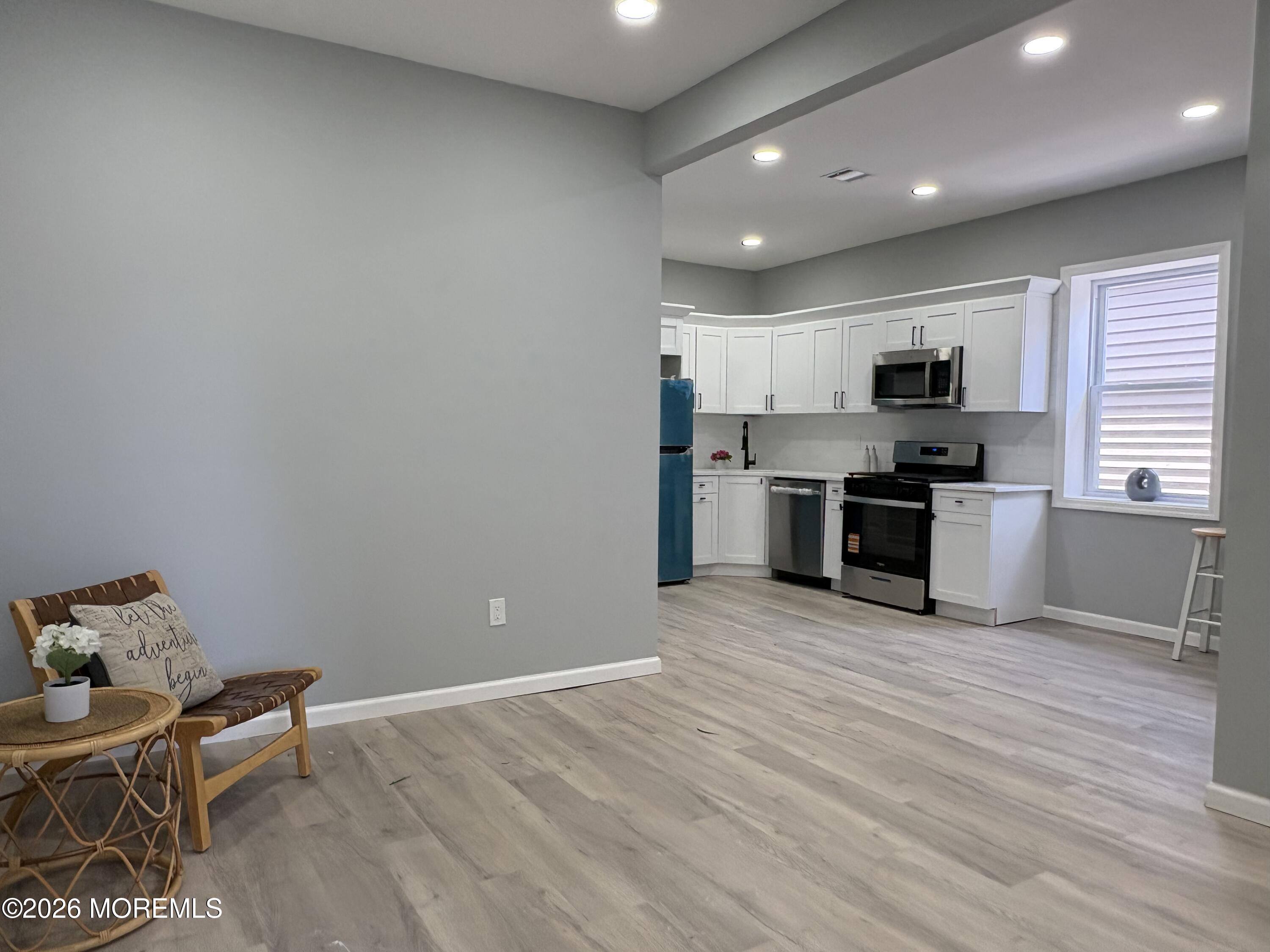 456 Harrison Street, Unit 2 Passaic, NJ 07055 - Photo 4 of 15 a view of kitchen with microwave and cabinets