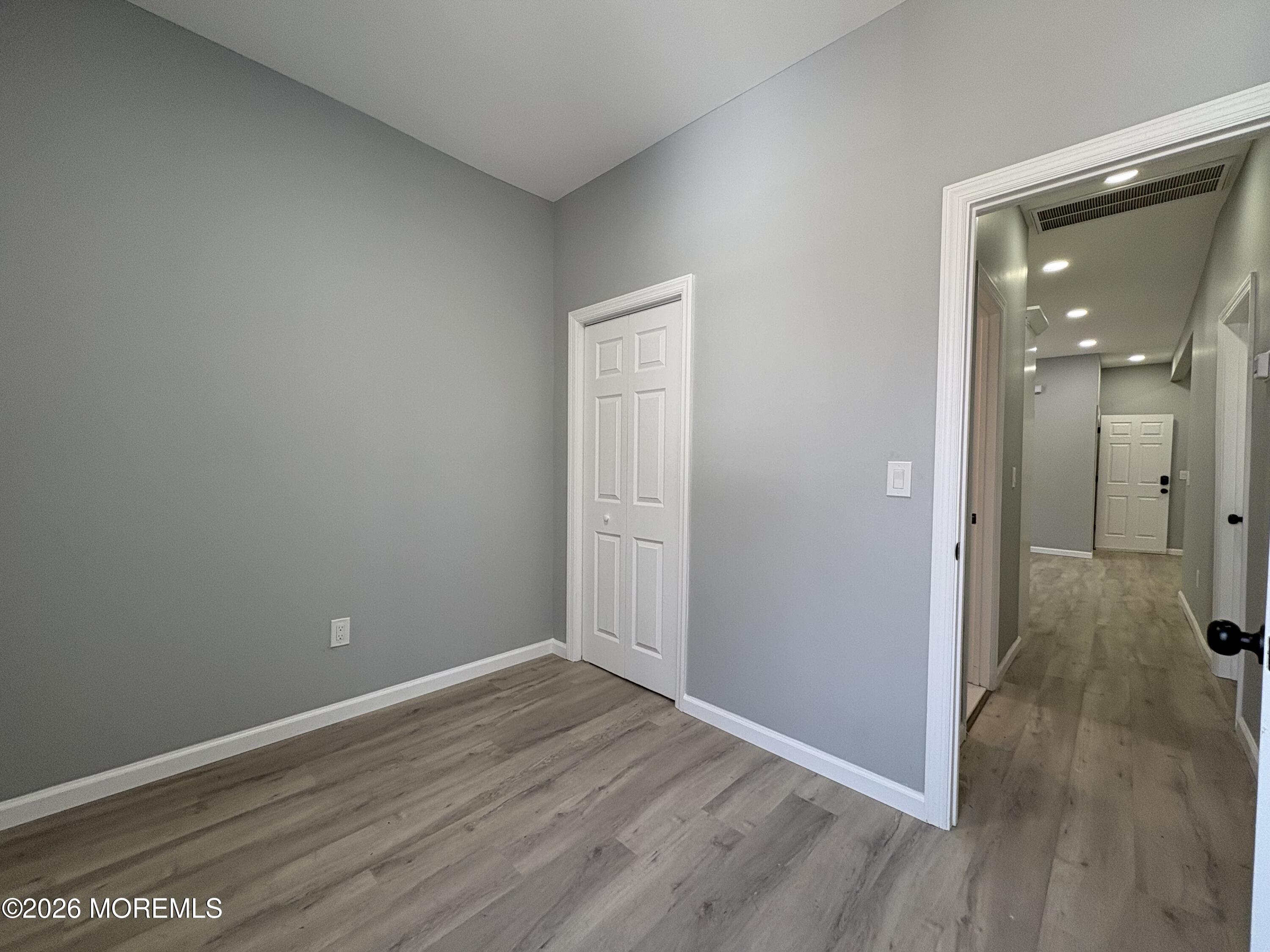 456 Harrison Street, Unit 2 Passaic, NJ 07055 - Photo 9 of 15 wooden floor in an empty room